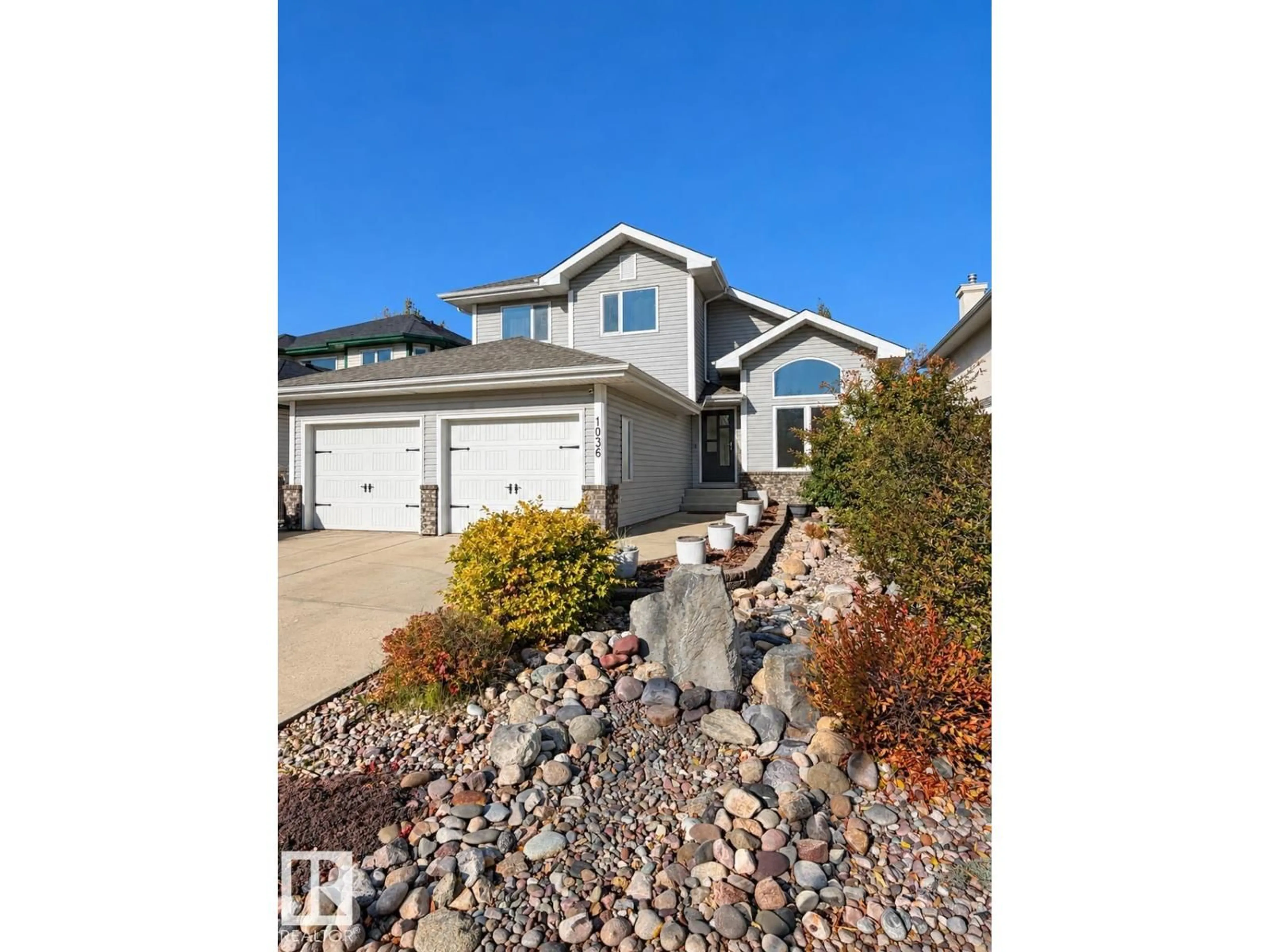 Home with vinyl exterior material, street for 1036 HOLGATE PL, Edmonton Alberta T6R2T7