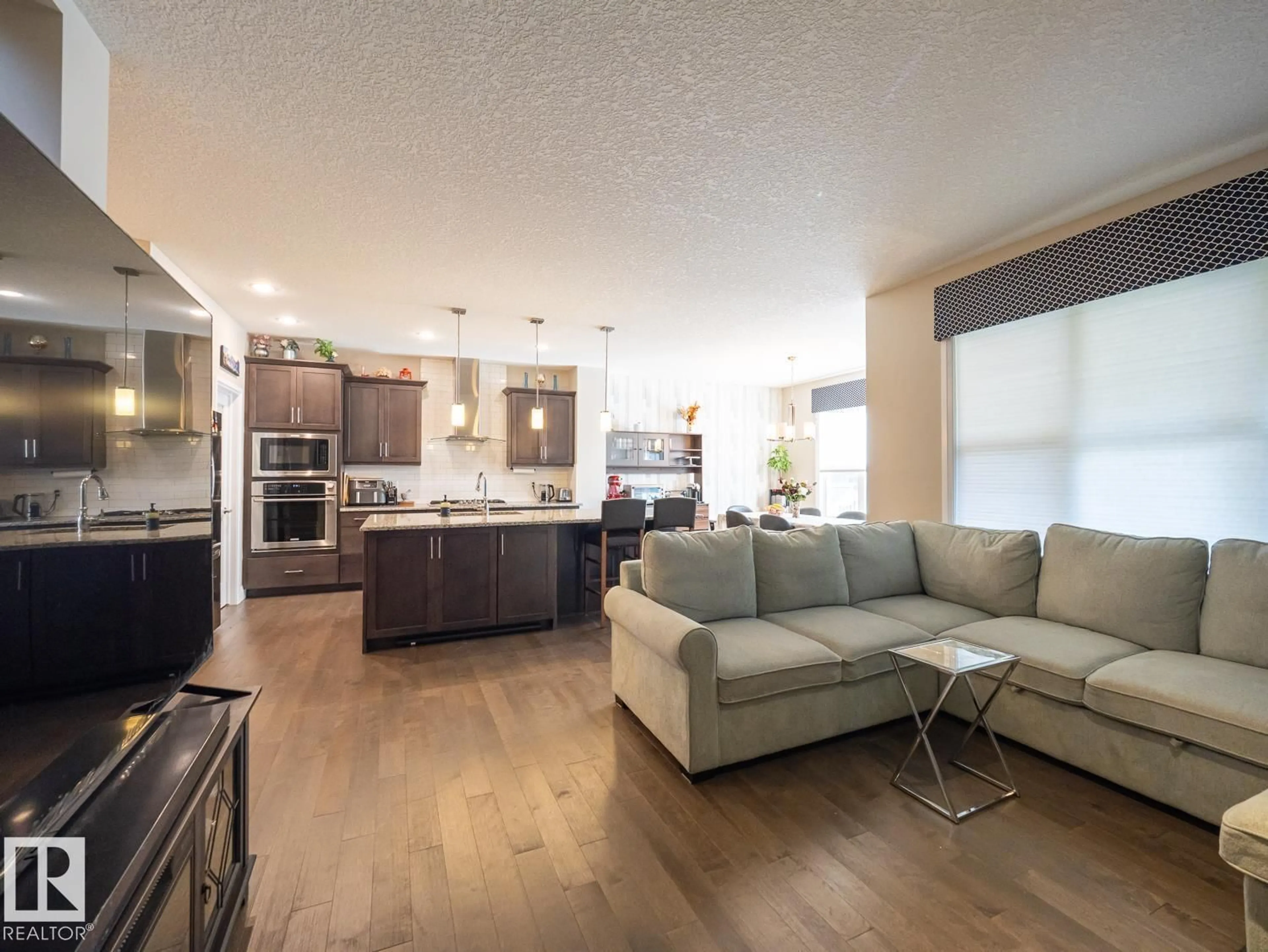 Open concept kitchen, wood/laminate floor for 121 SUNWOOD BAY, Sherwood Park Alberta T8H0Z6