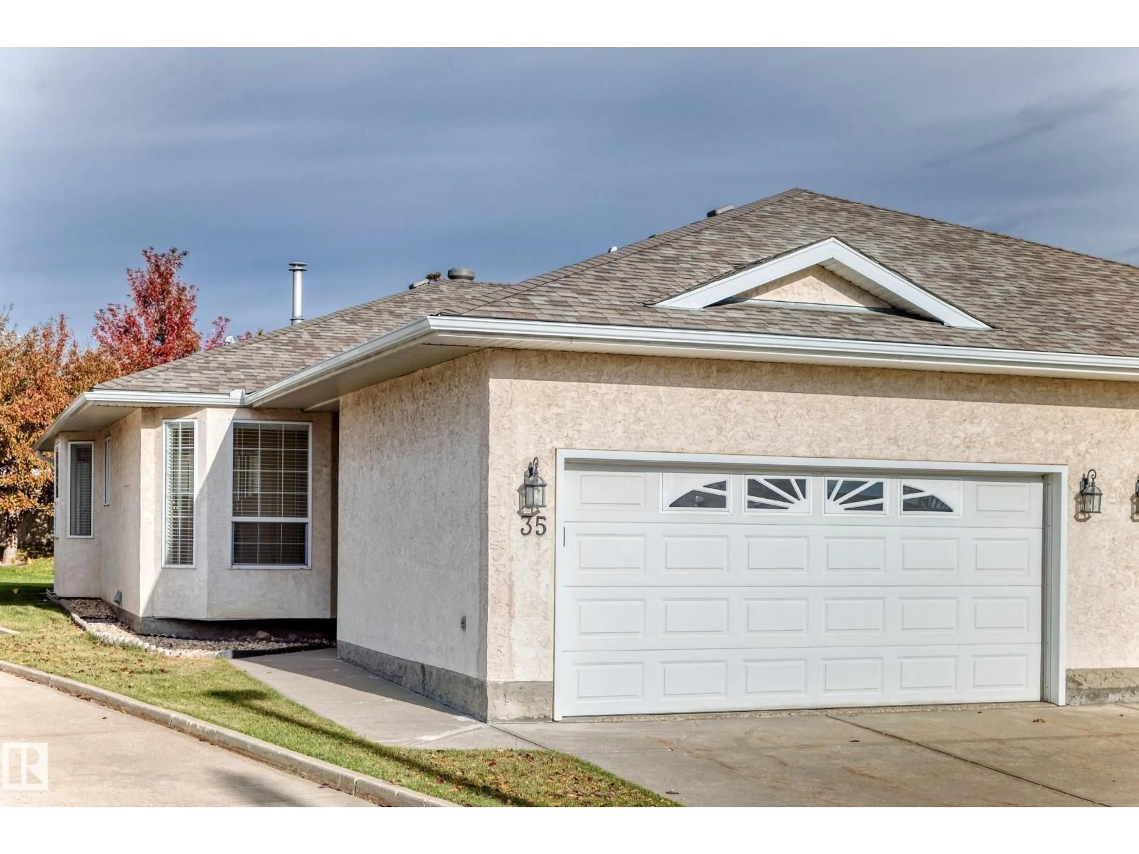 Home with vinyl exterior material, street for 35 - 14428 MILLER BV, Edmonton Alberta T5Y2Y6