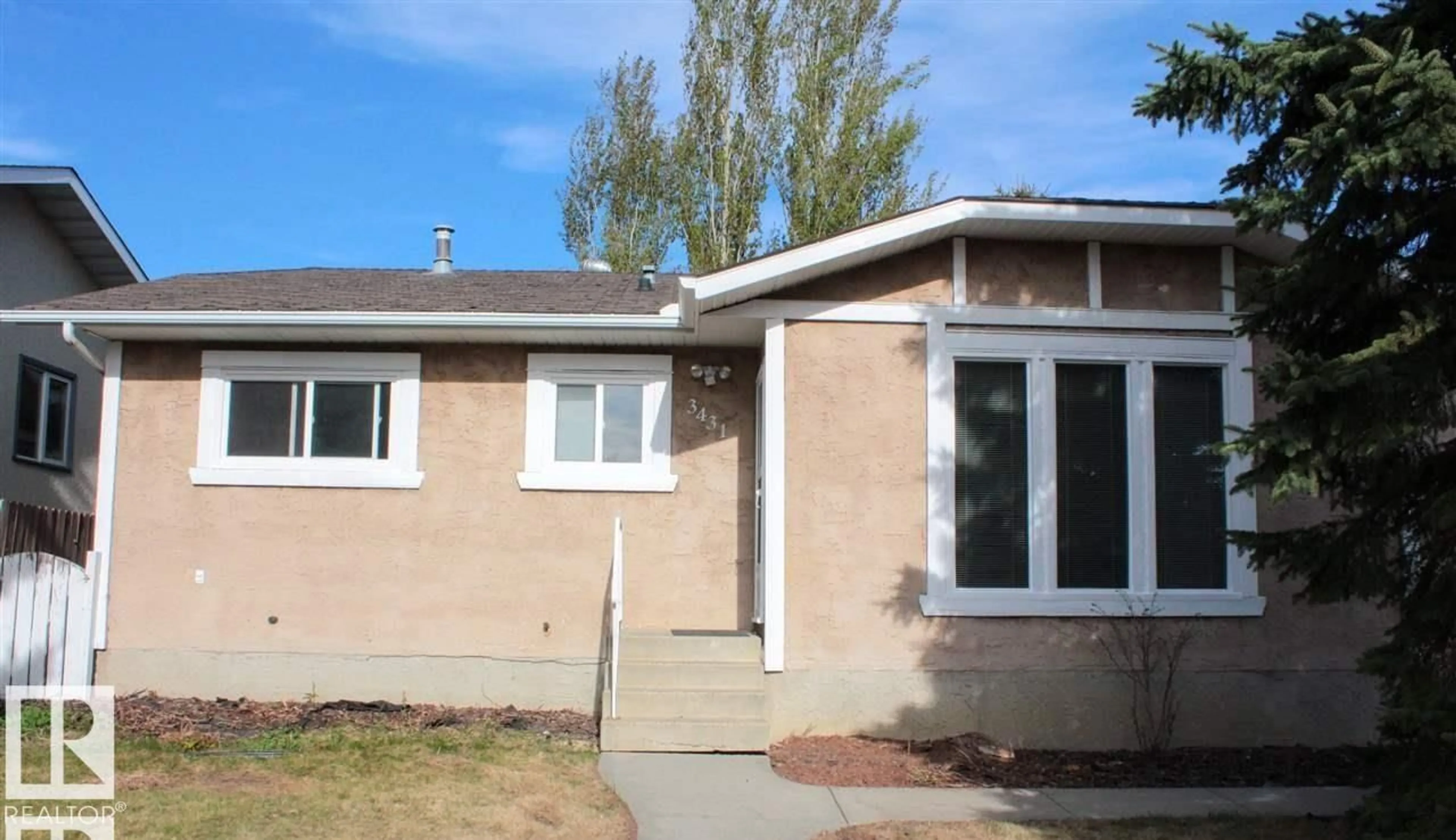Home with vinyl exterior material, street for 3431 42 ST, Edmonton Alberta T6L3Z4