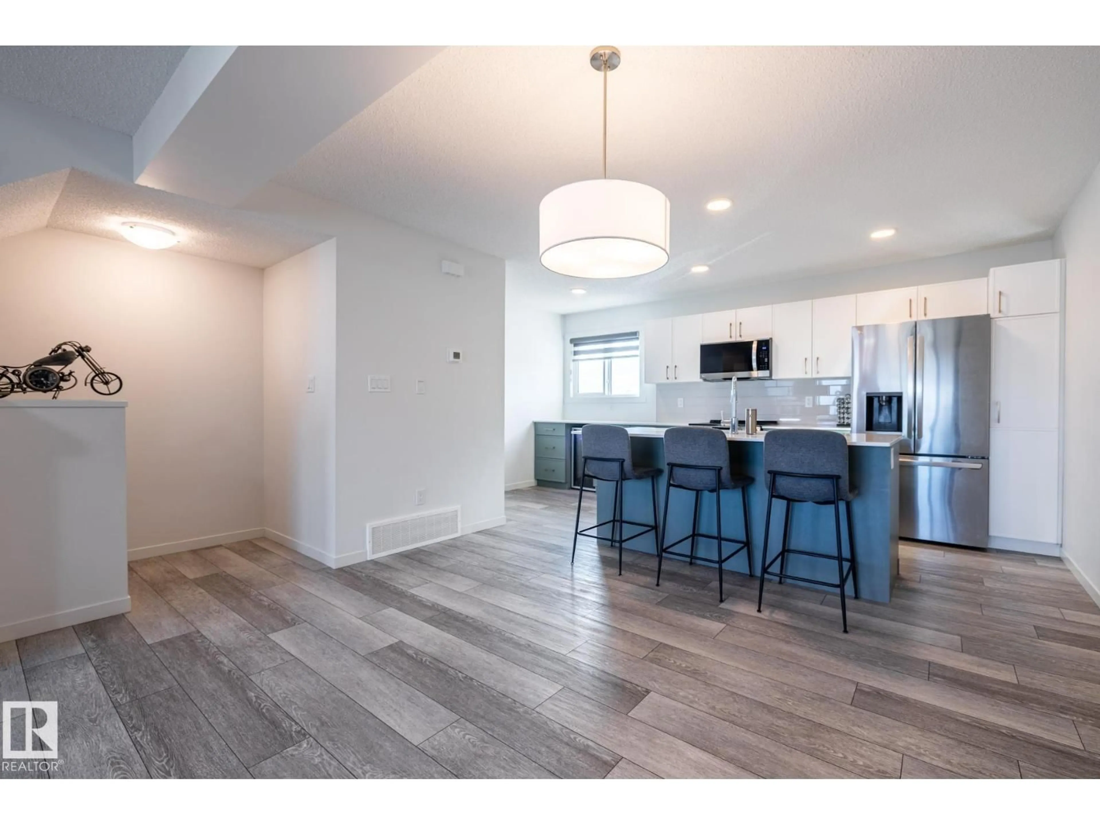 Open concept kitchen, wood/laminate floor for 1273 MCLEOD AV, Spruce Grove Alberta T7X2Y4