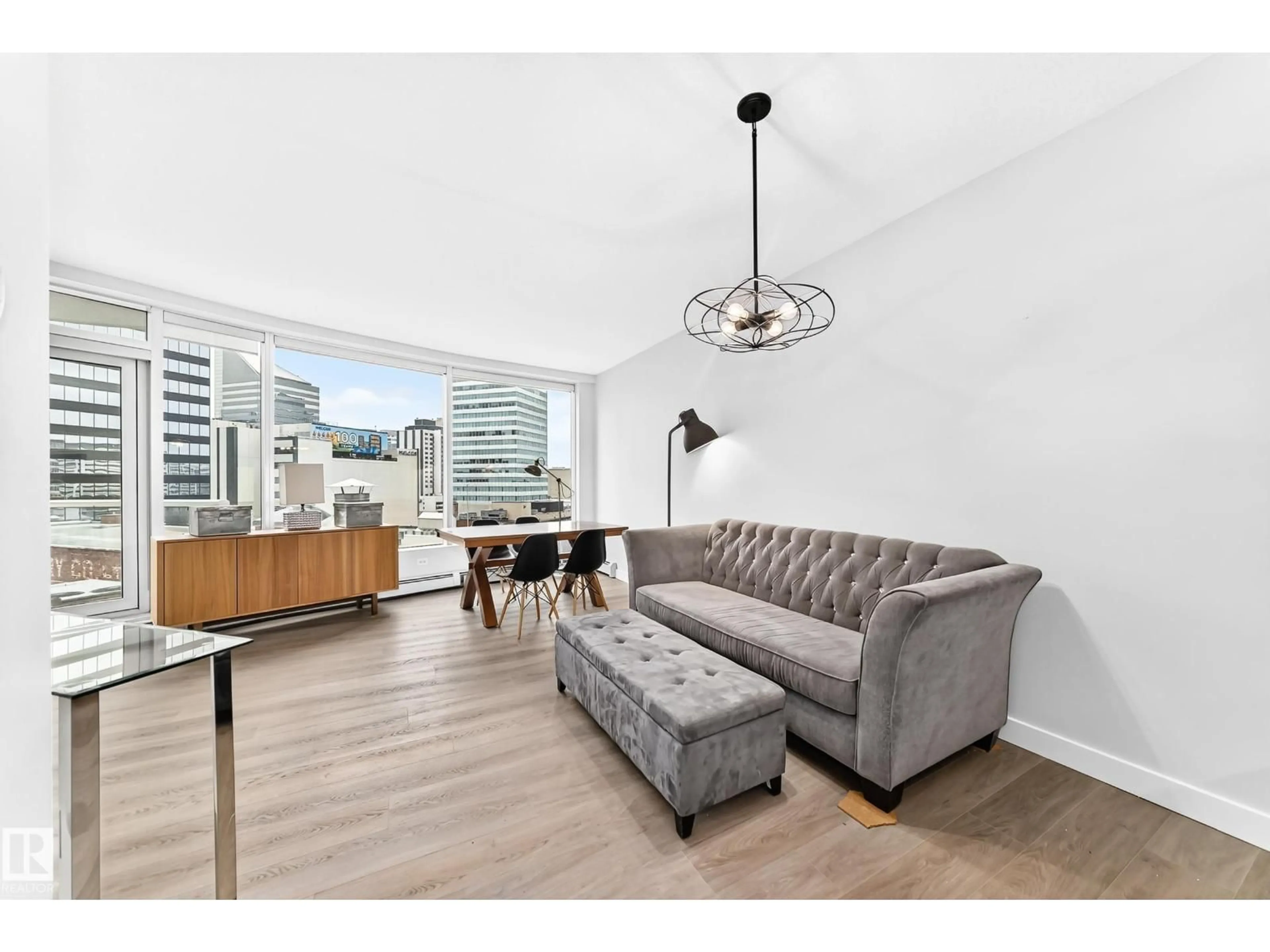 Living room with furniture, wood/laminate floor for #703 - 10152 104 ST NW, Edmonton Alberta T5J0B6