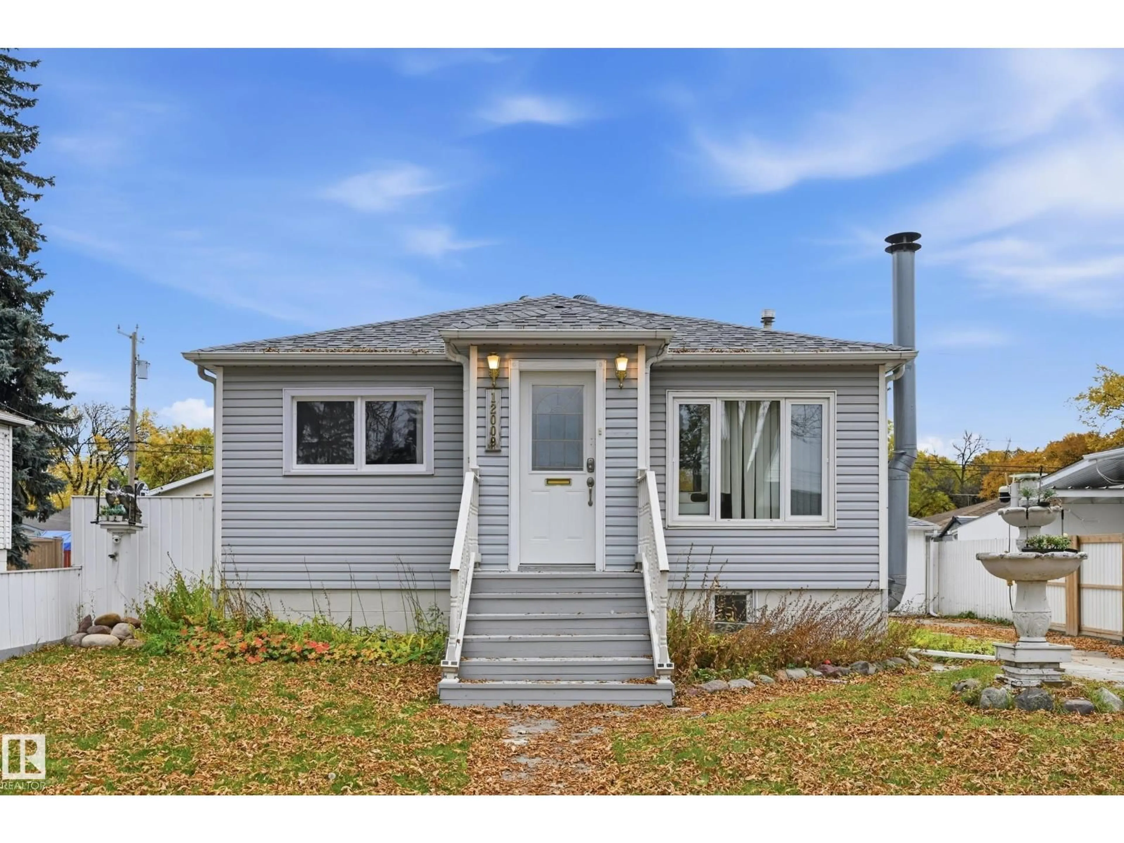 Home with vinyl exterior material, street for 12009 49 ST, Edmonton Alberta T5W3A3