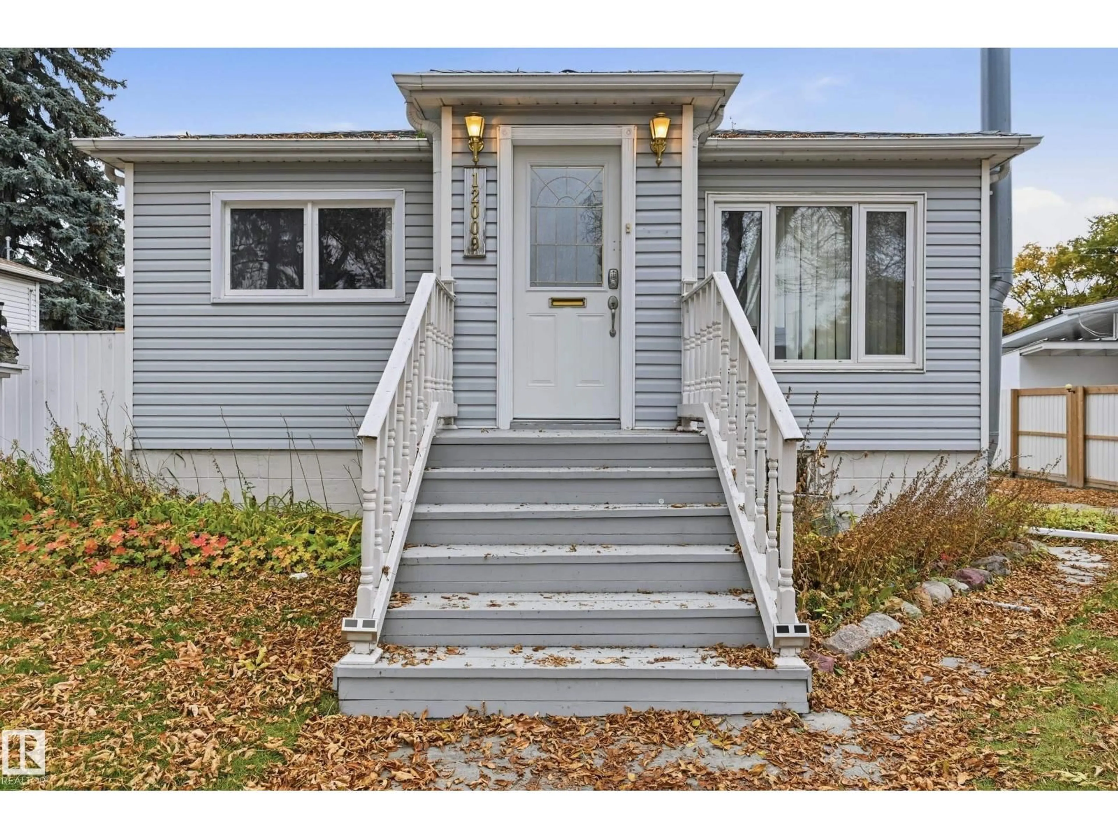 Home with vinyl exterior material, street for 12009 49 ST, Edmonton Alberta T5W3A3