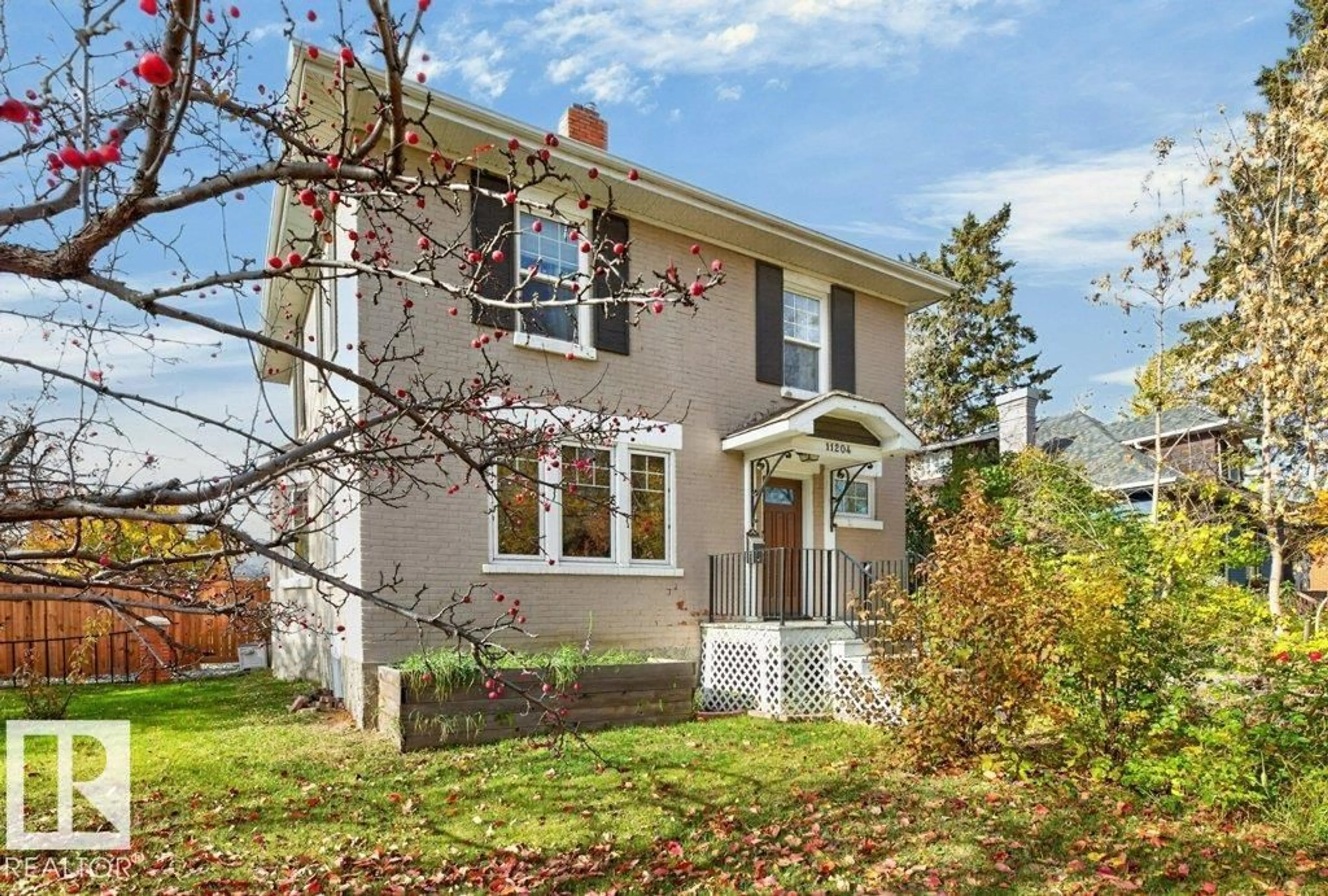 Home with vinyl exterior material, street for NW - 11204 127 ST, Edmonton Alberta T5M0T6