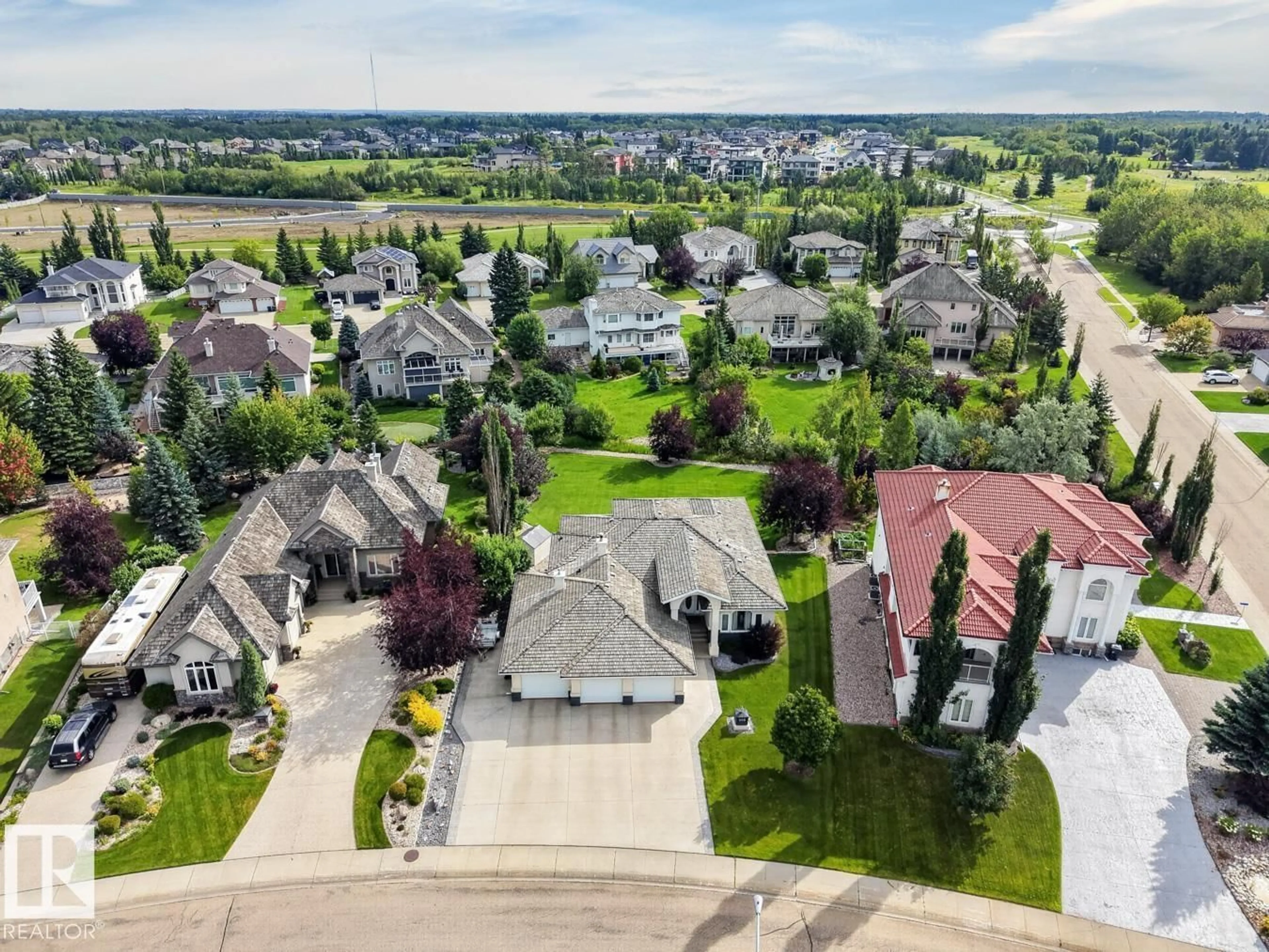 A pic from outside/outdoor area/front of a property/back of a property/a pic from drone, street for #203 - 52304 RGE ROAD 233, Rural Strathcona County Alberta T8B1C9