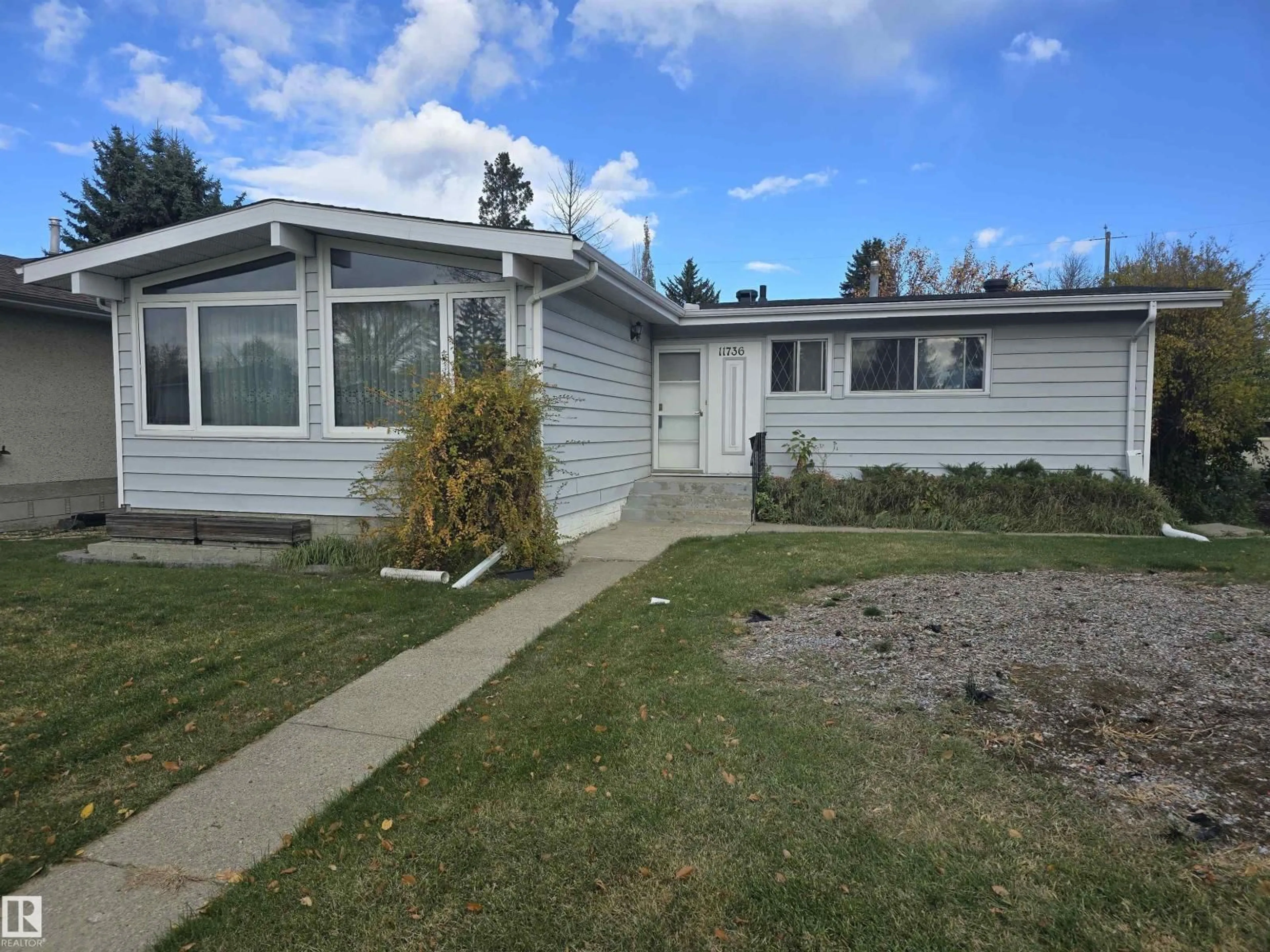 Home with vinyl exterior material, street for 11736 43 AV, Edmonton Alberta T6J0Y7
