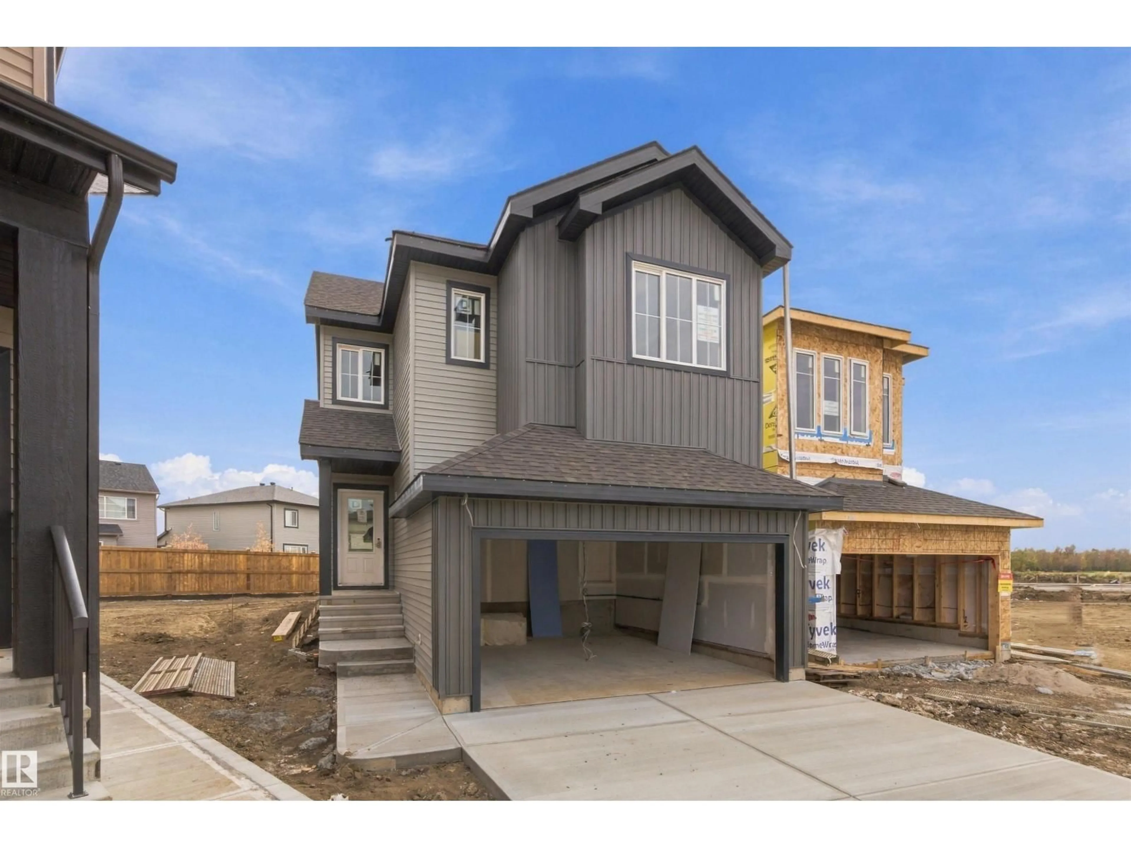 Home with vinyl exterior material, street for NW - 1511 208 ST, Edmonton Alberta T6M3N8