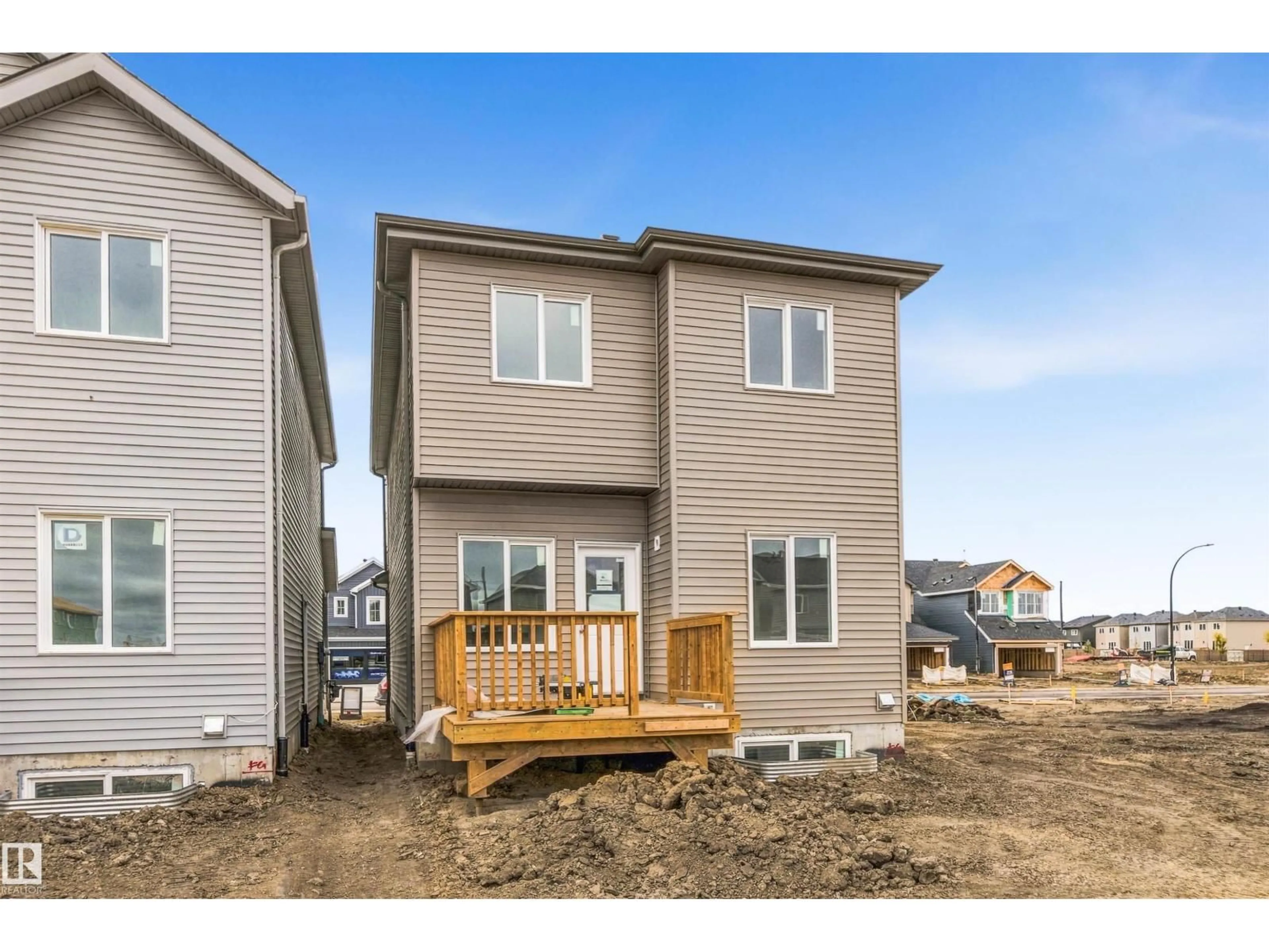 Home with vinyl exterior material, street for 614 ASHGROVE CI, Leduc Alberta T9E1X4
