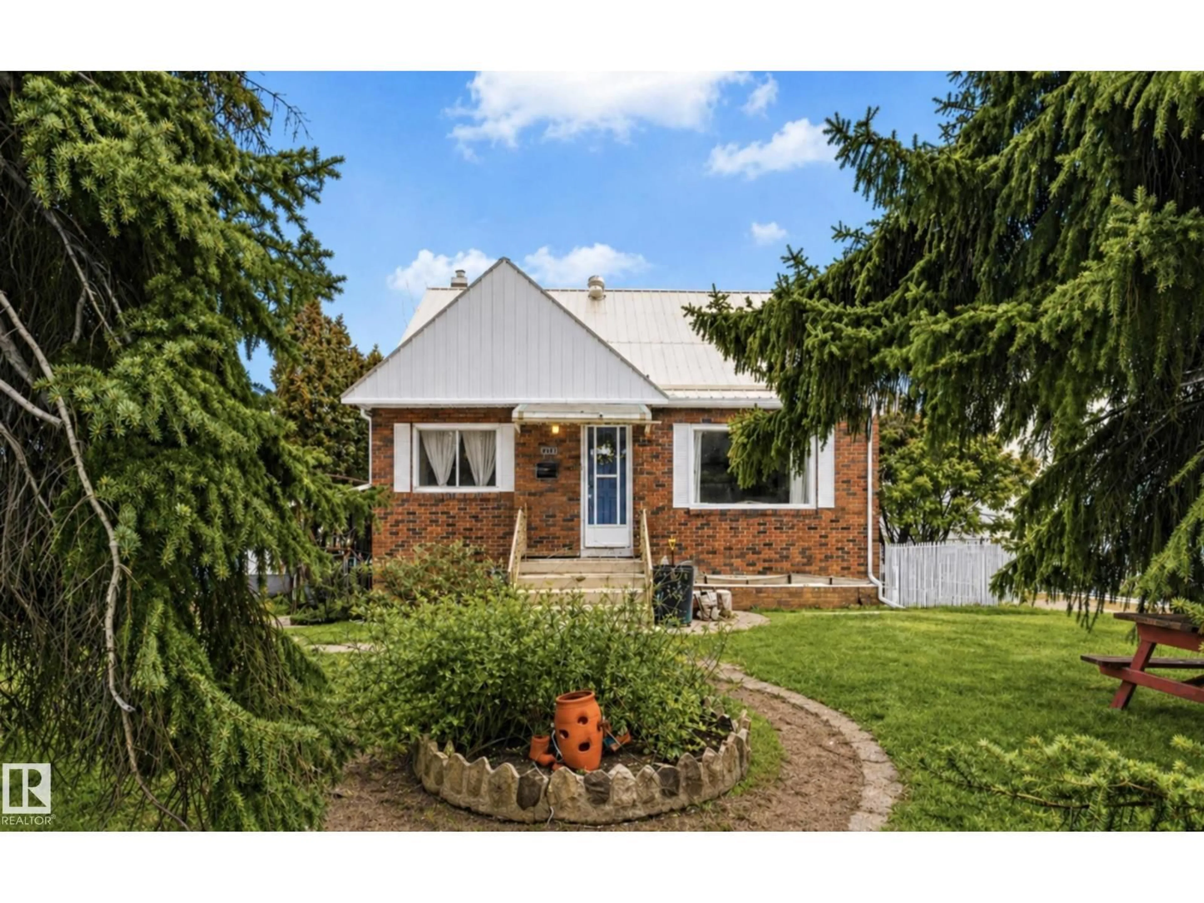 Home with brick exterior material, street for 7703 77 AV, Edmonton Alberta T6C0K6