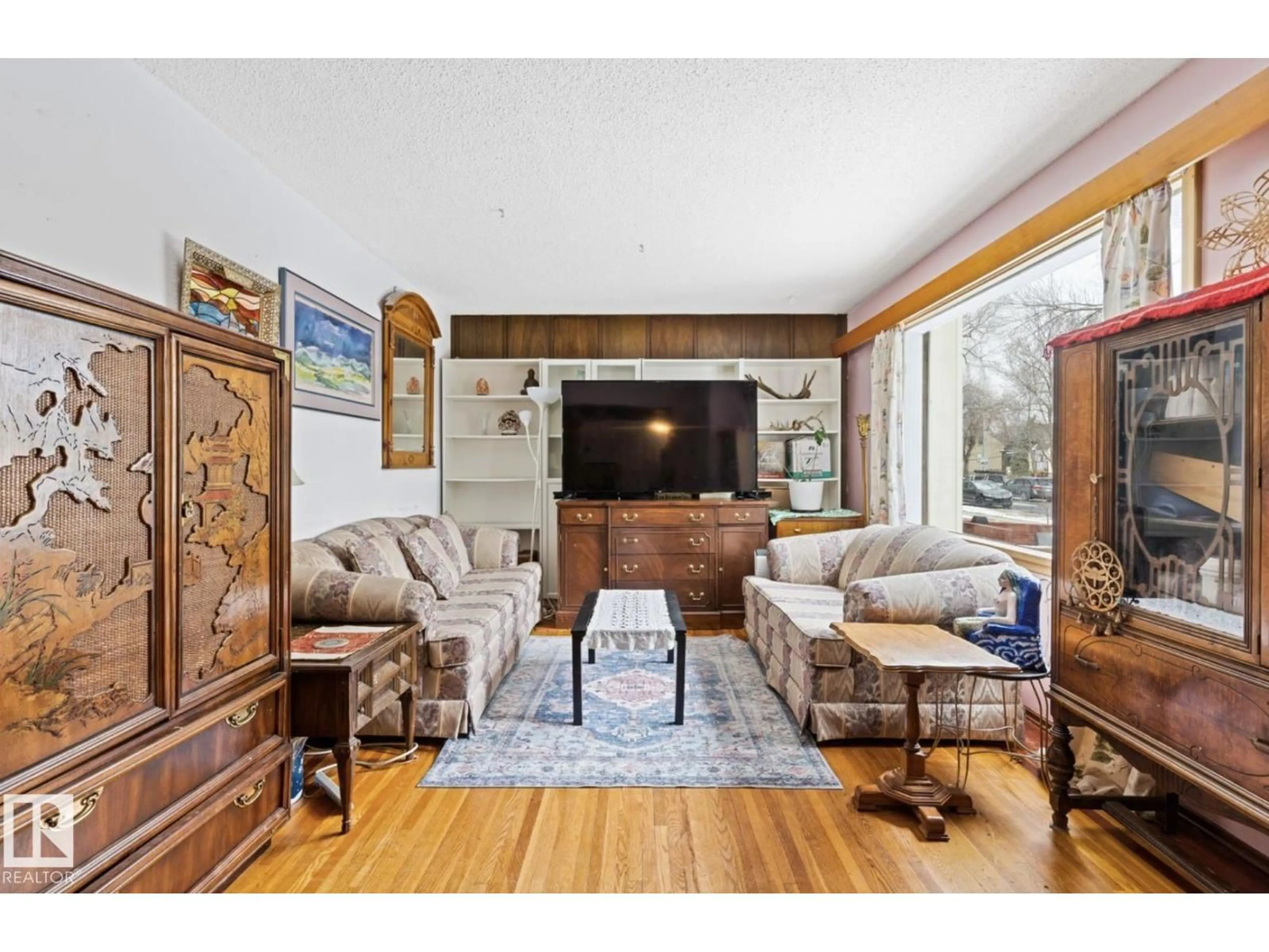 Living room with furniture, unknown for 7703 77 AV, Edmonton Alberta T6C0K6