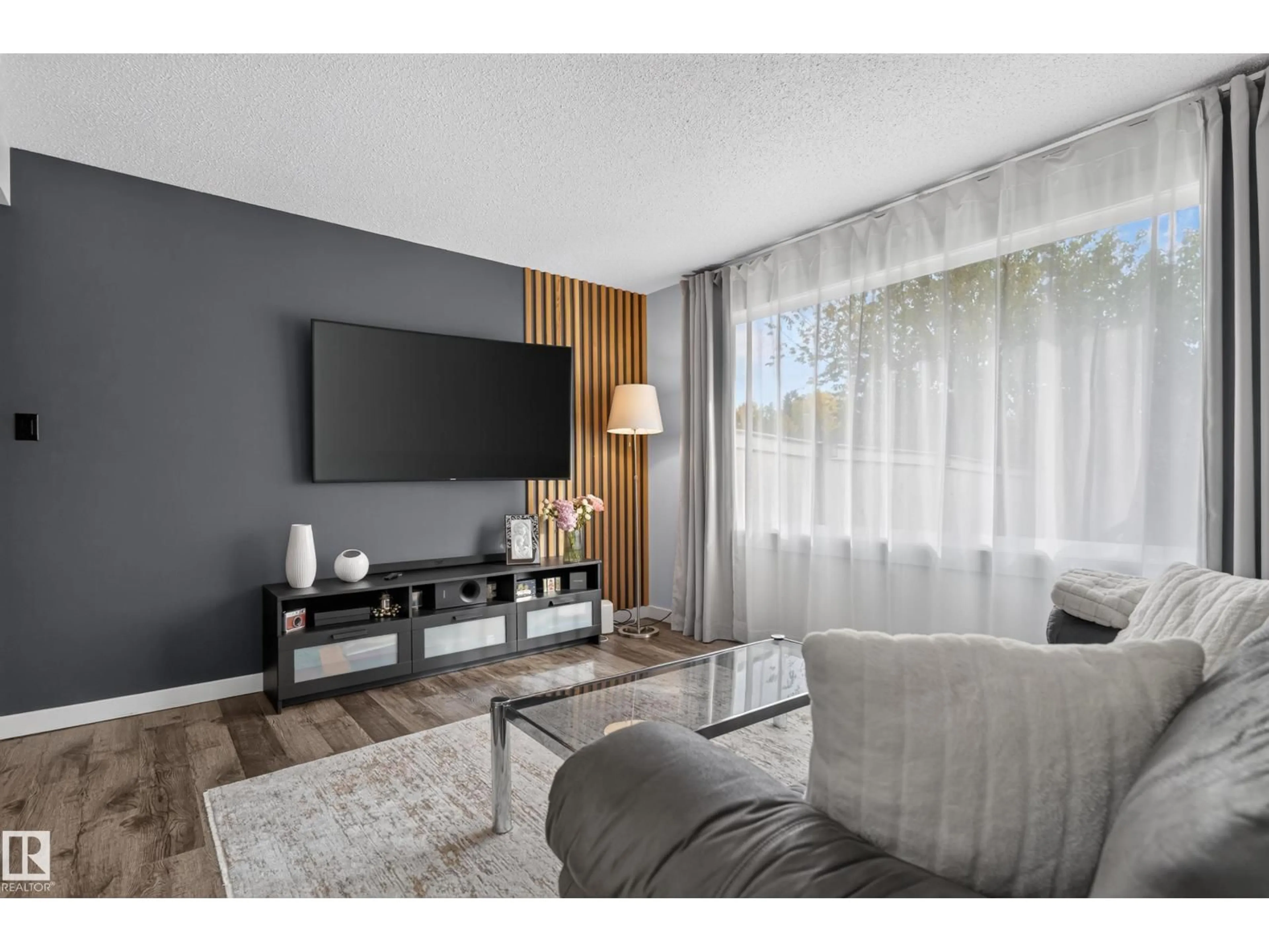 Living room with furniture, wood/laminate floor for 176 CALLINGWOOD PL, Edmonton Alberta T5T2C6