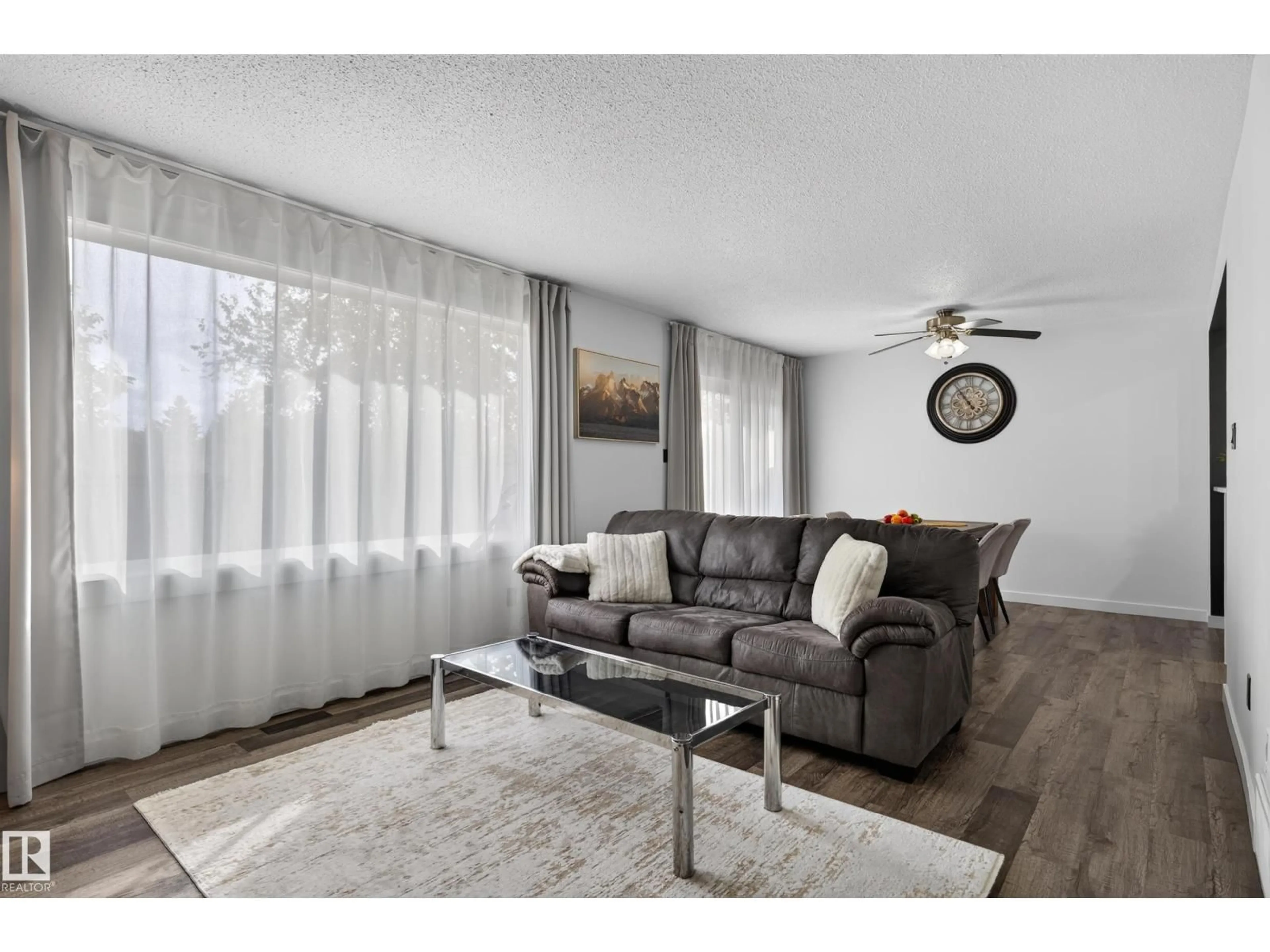 Living room with furniture, wood/laminate floor for 176 CALLINGWOOD PL, Edmonton Alberta T5T2C6