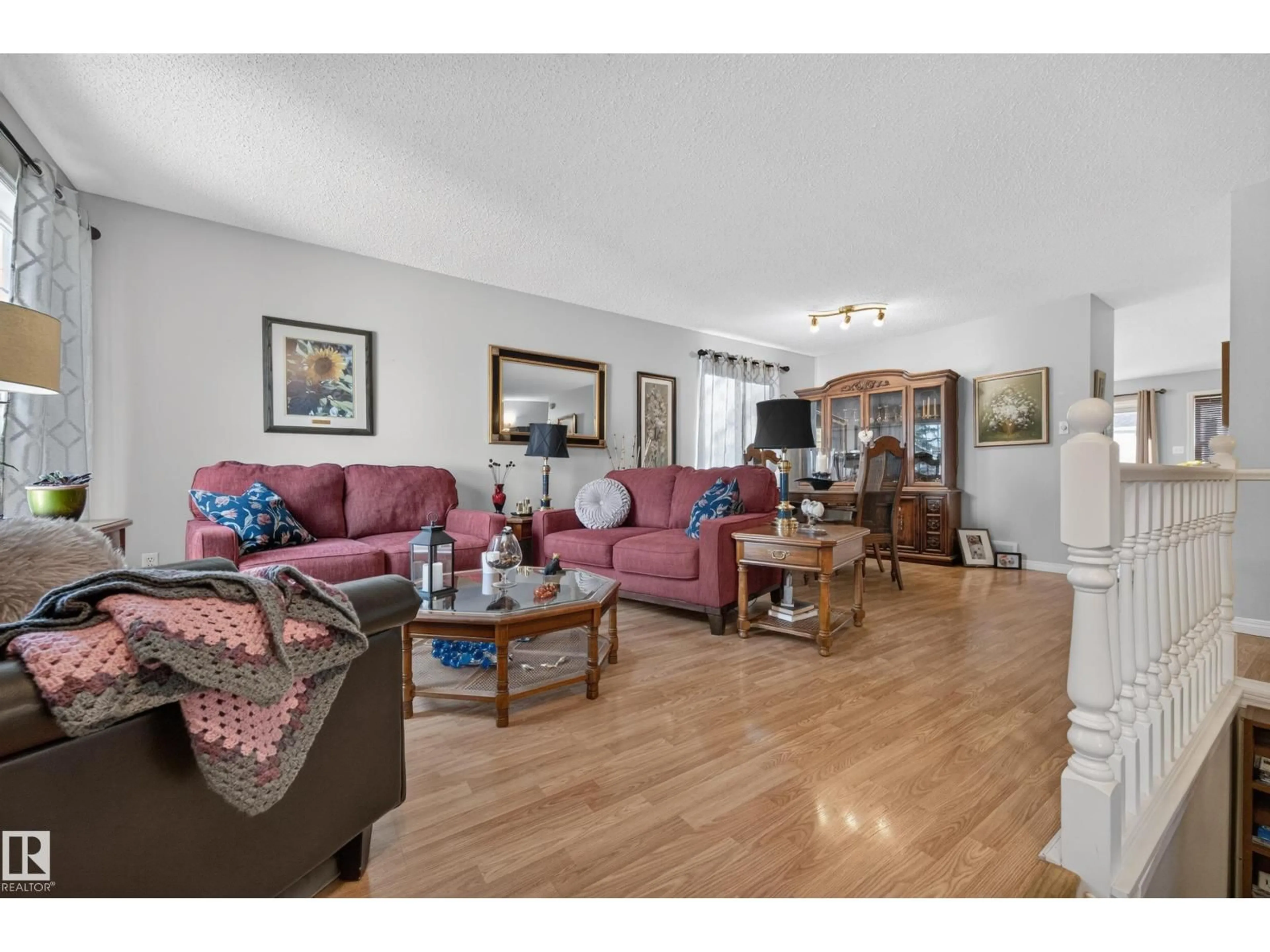 Living room with furniture, wood/laminate floor for 524 RAINBOW CR, Sherwood Park Alberta T8A5M8