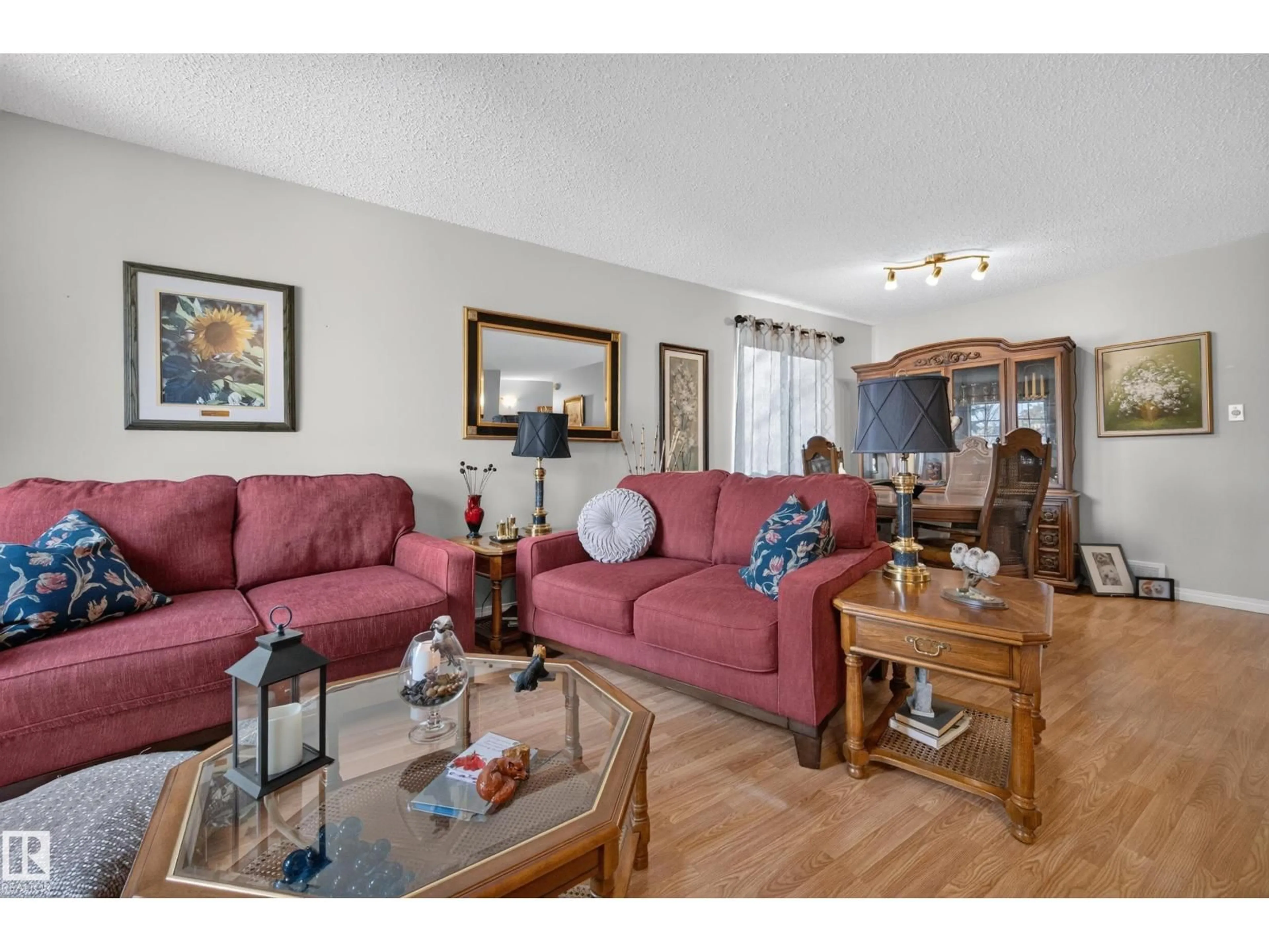 Living room with furniture, wood/laminate floor for 524 RAINBOW CR, Sherwood Park Alberta T8A5M8