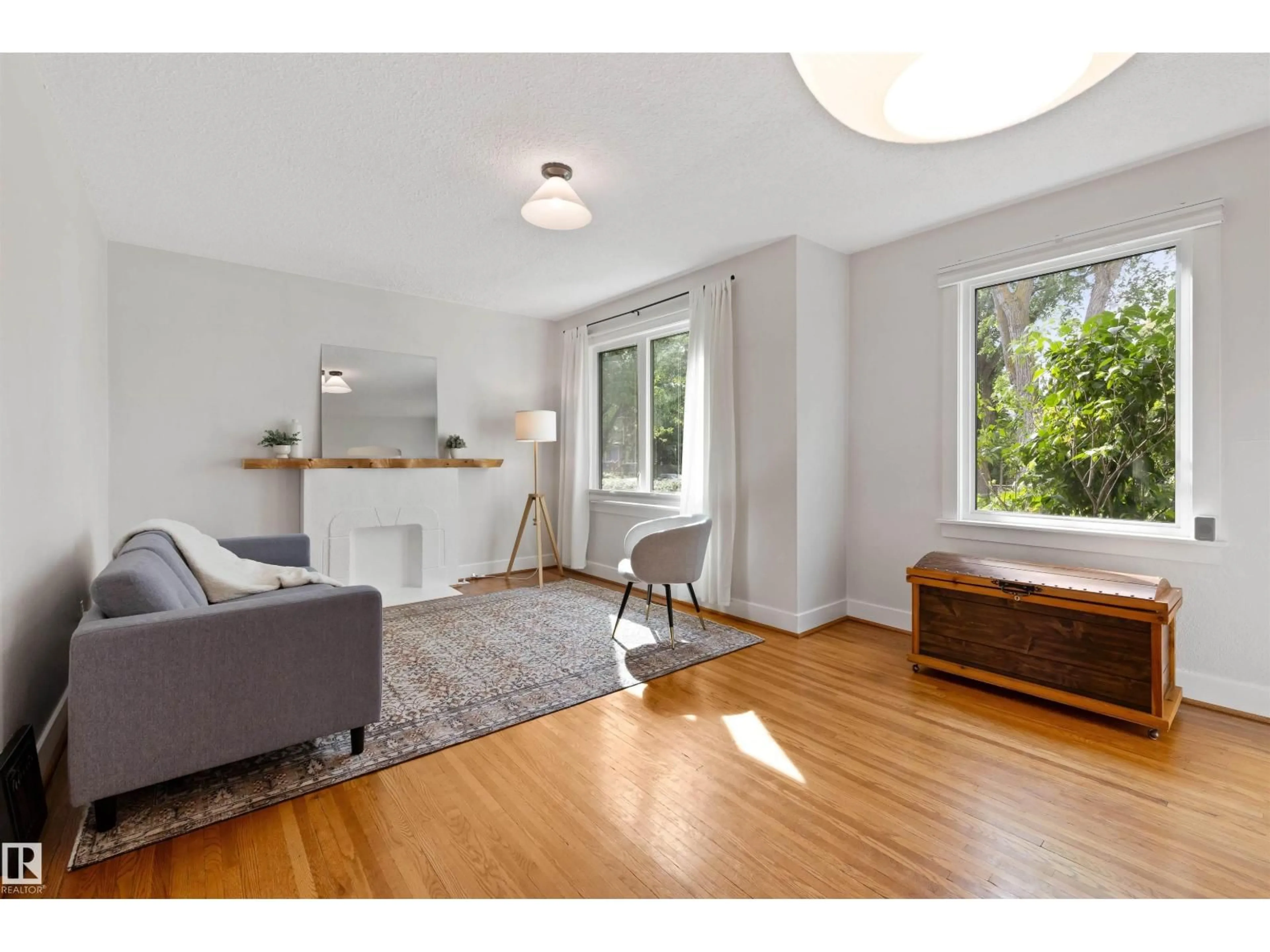 Living room with furniture, wood/laminate floor for NW - 11623 123 ST, Edmonton Alberta T5M0G7