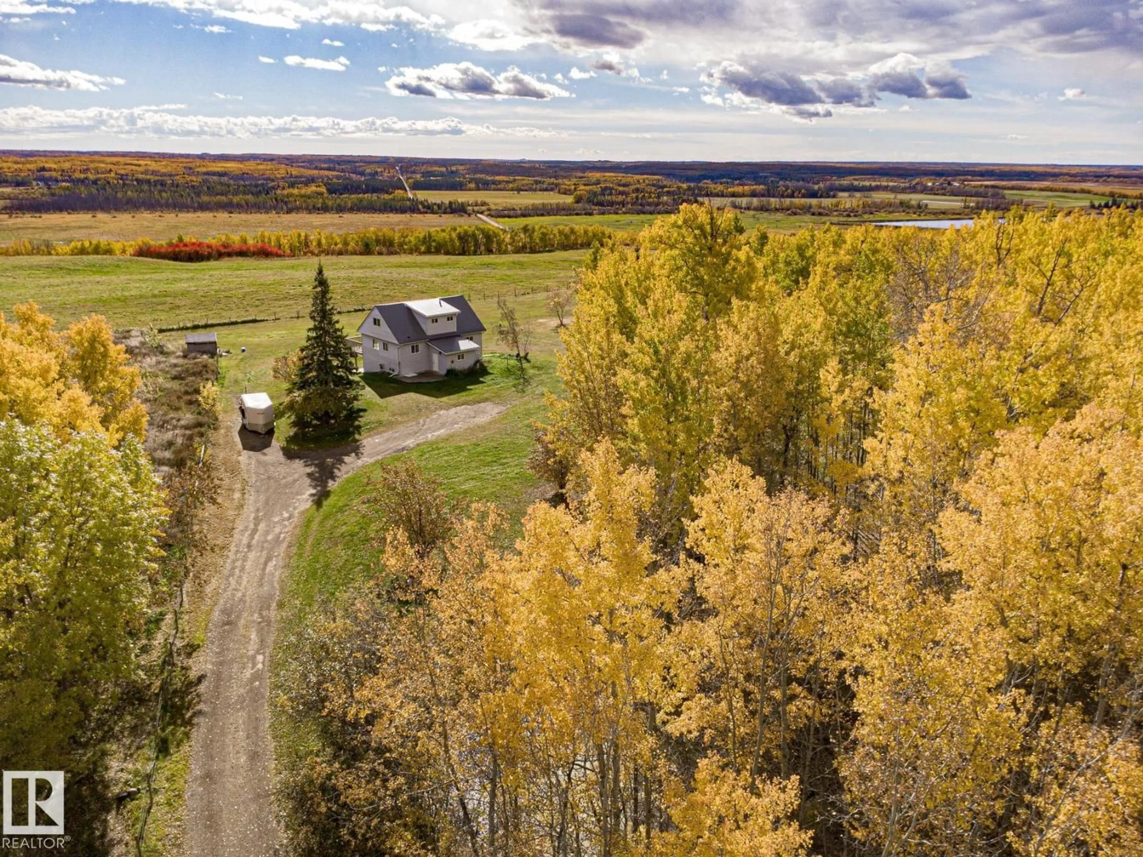 A pic from outside/outdoor area/front of a property/back of a property/a pic from drone, forest/trees view for #203 - 1414 HWY 37, Rural Lac Ste. Anne County Alberta T0E1V0