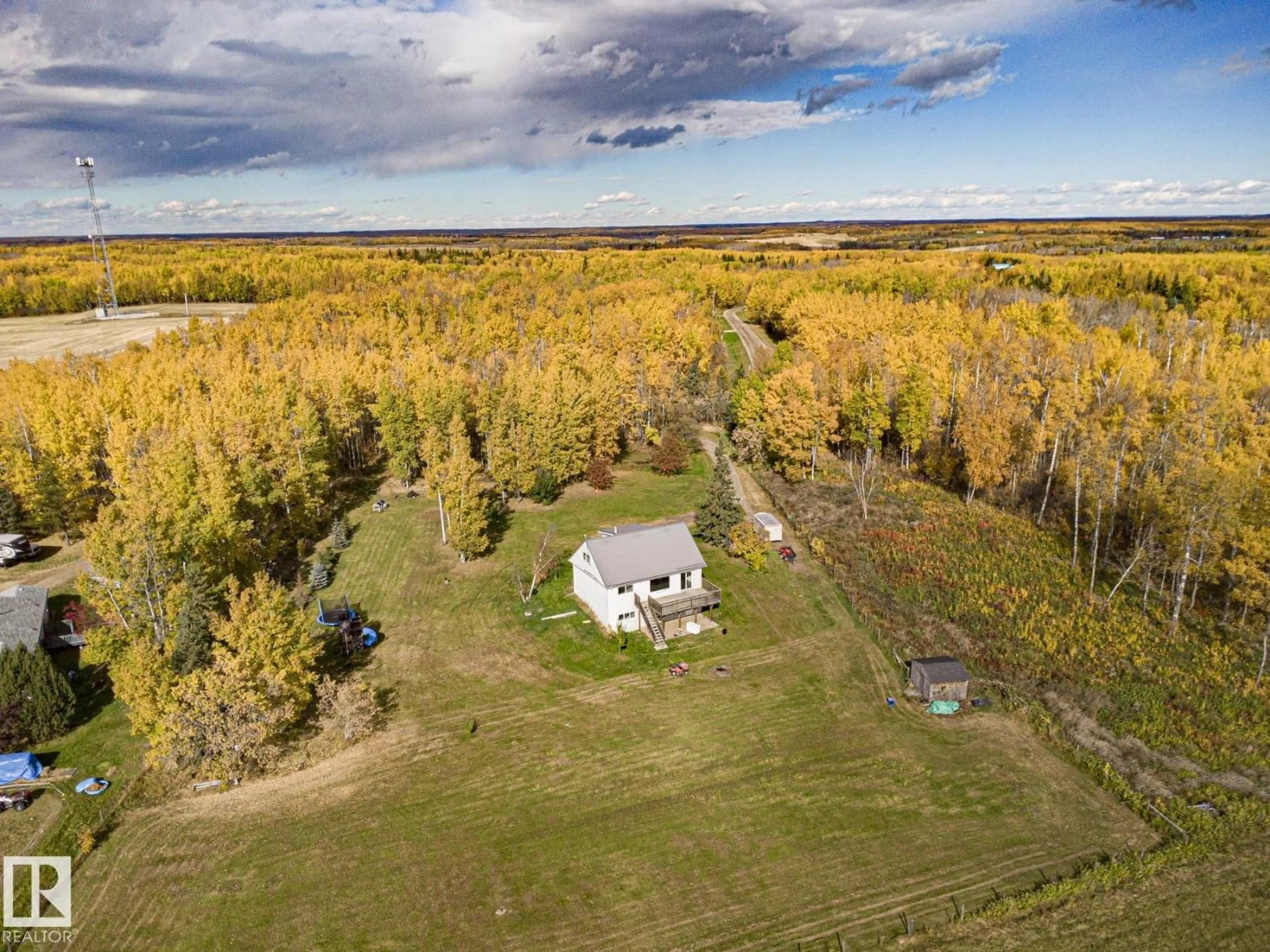 A pic from outside/outdoor area/front of a property/back of a property/a pic from drone, forest/trees view for #203 - 1414 HWY 37, Rural Lac Ste. Anne County Alberta T0E1V0