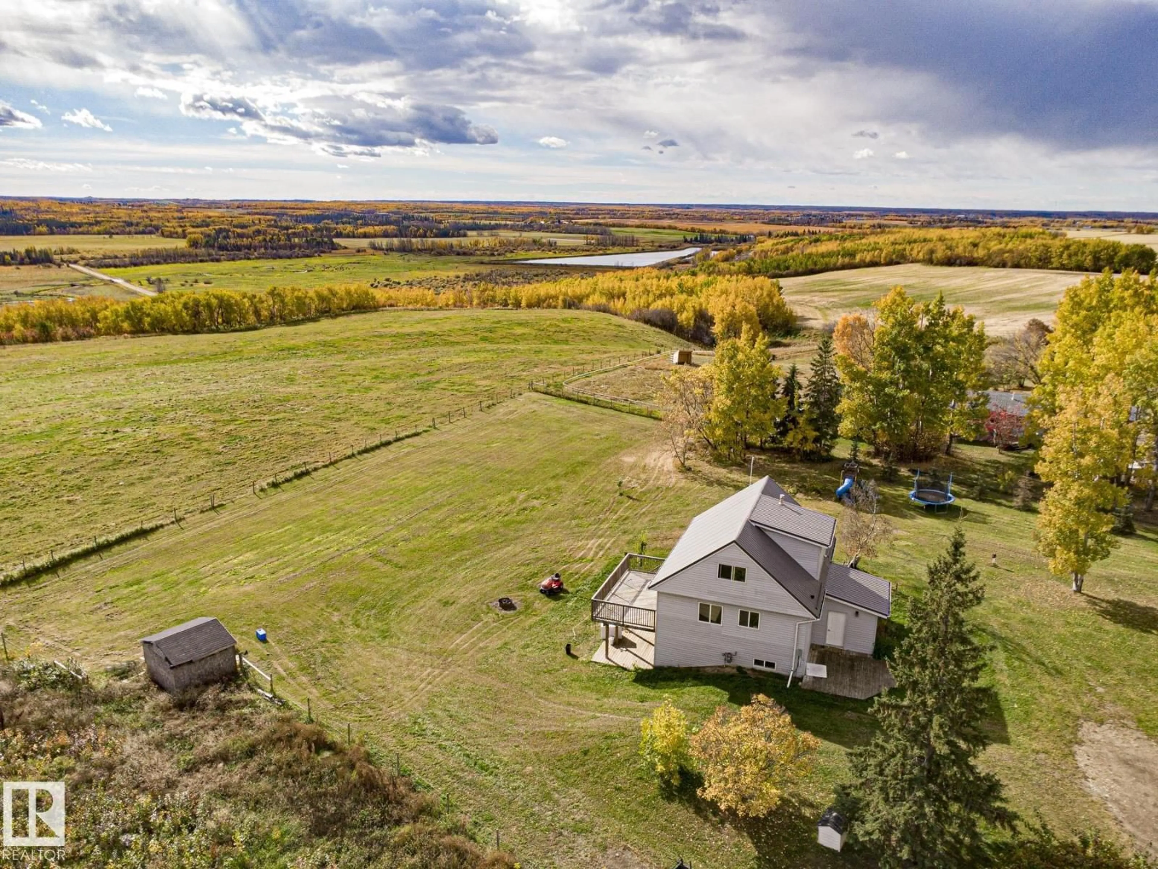 A pic from outside/outdoor area/front of a property/back of a property/a pic from drone, unknown for #203 - 1414 HWY 37, Rural Lac Ste. Anne County Alberta T0E1V0