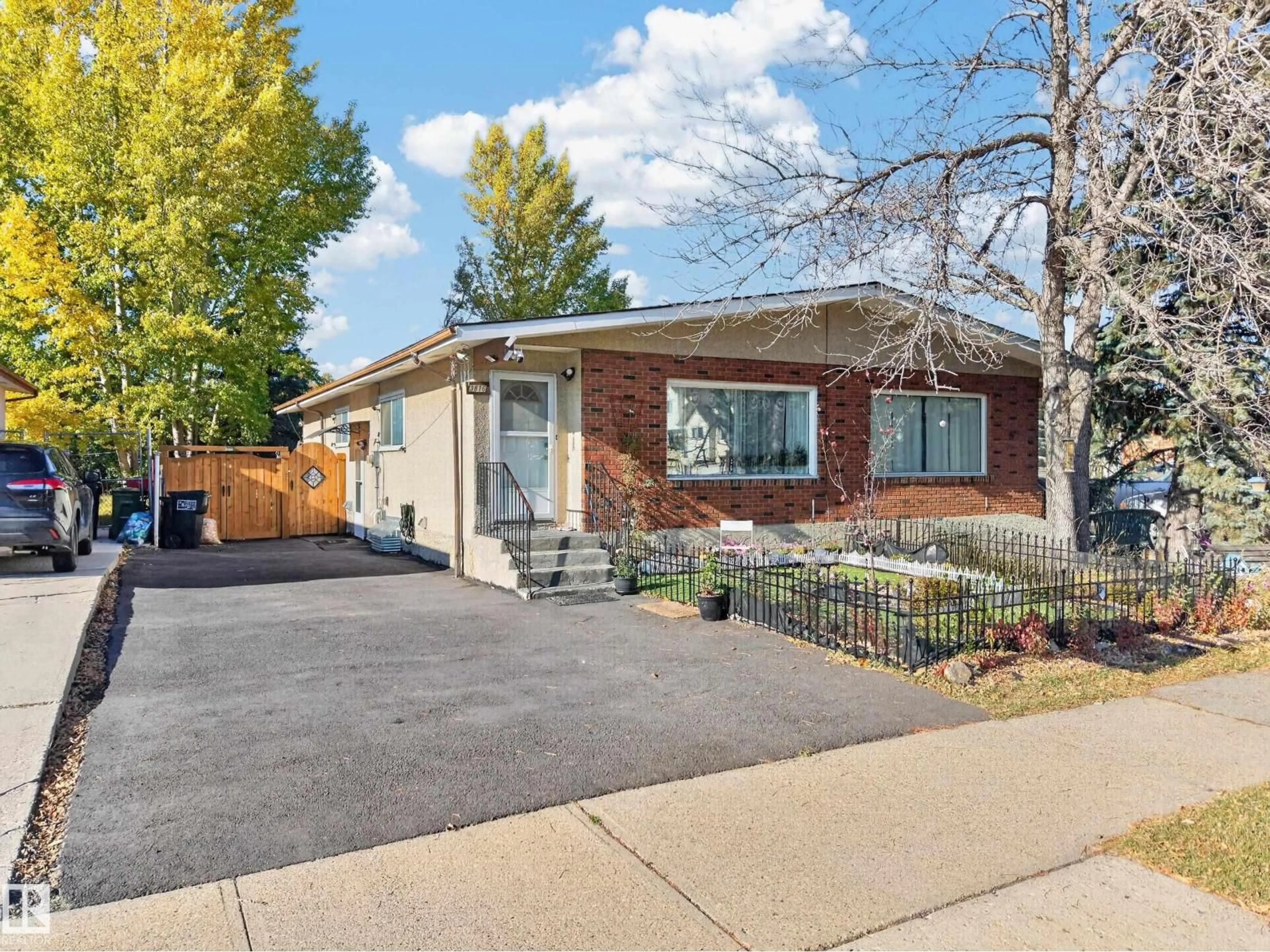 Home with brick exterior material, street for 3816 85 ST, Edmonton Alberta T6K0H6