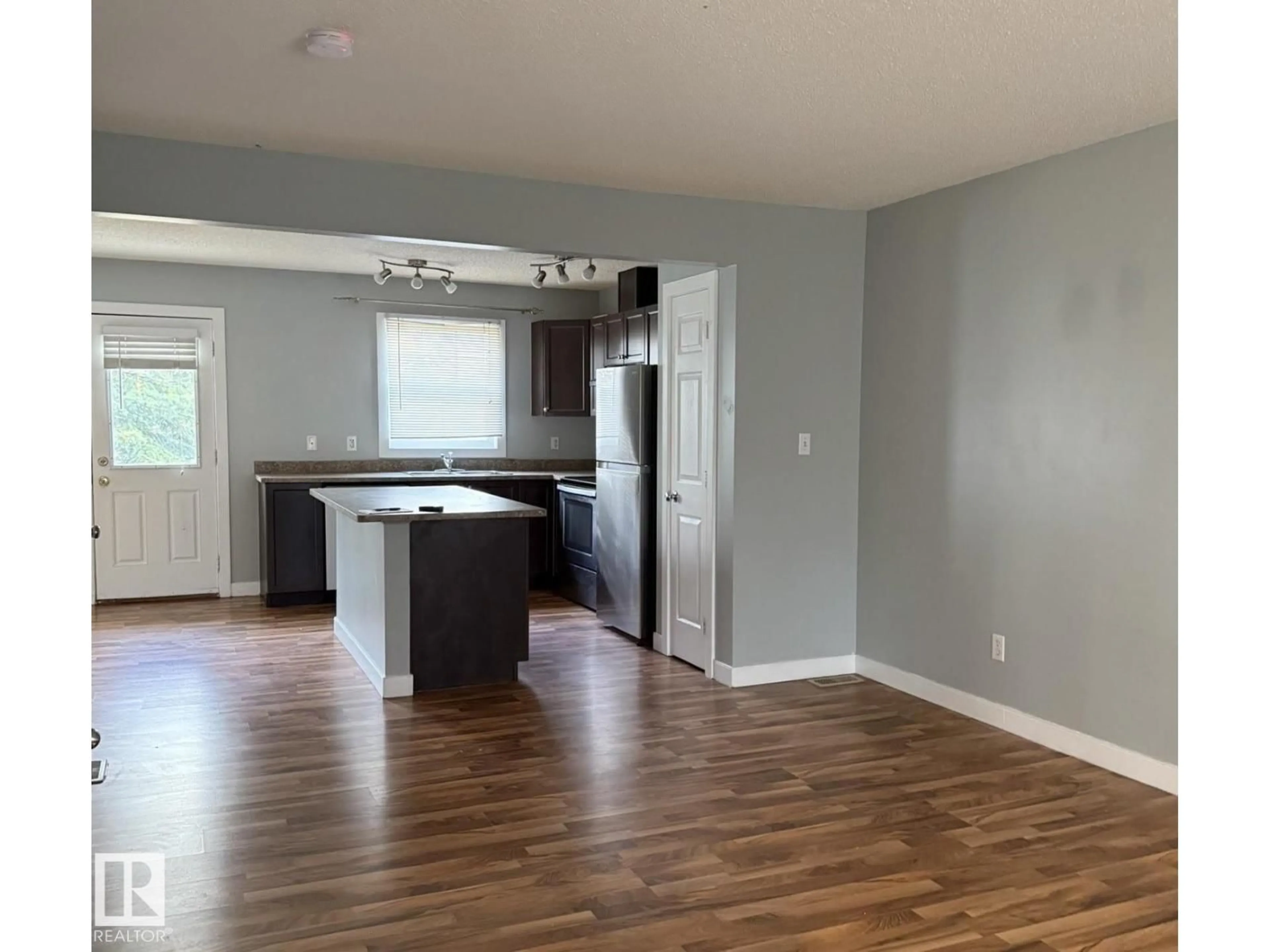 Open concept kitchen, wood/laminate floor for #30 - 6032 38 AV, Edmonton Alberta T6L0A4