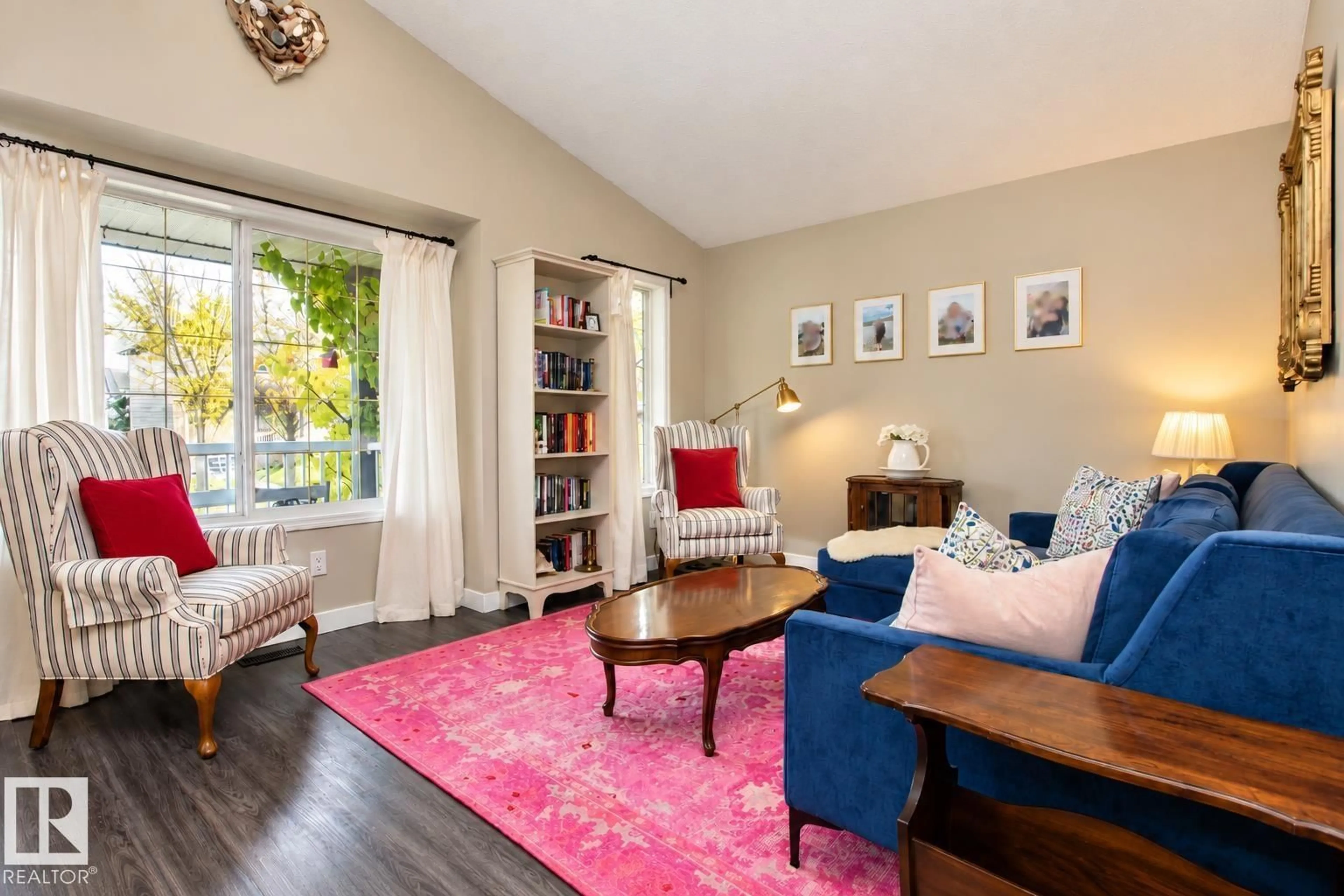 Living room with furniture, wood/laminate floor for 2811 25 ST, Edmonton Alberta T6T2A3