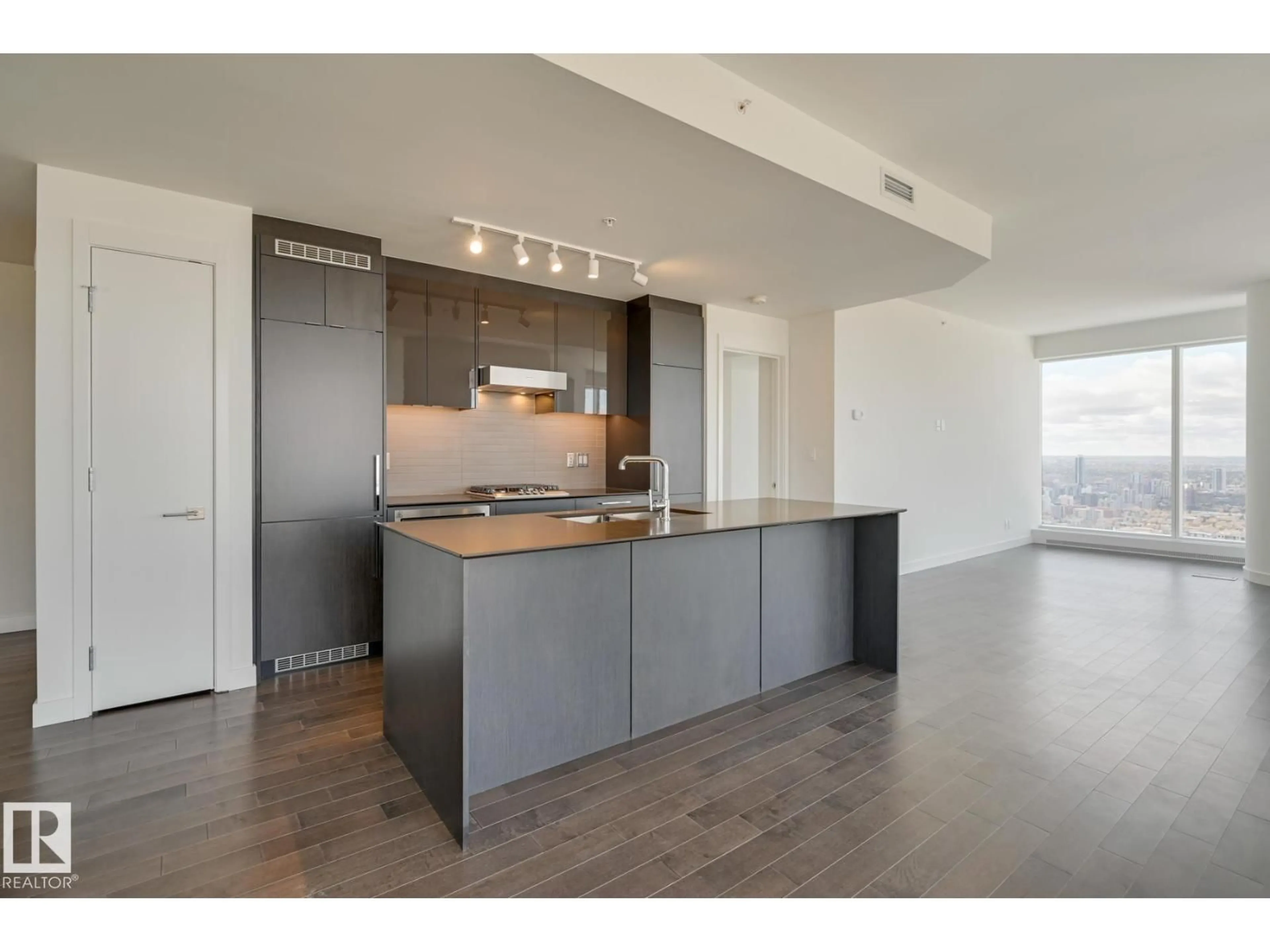 Open concept kitchen, wood/laminate floor for 10360 - 4201 102 ST NW, Edmonton Alberta T5J0K6