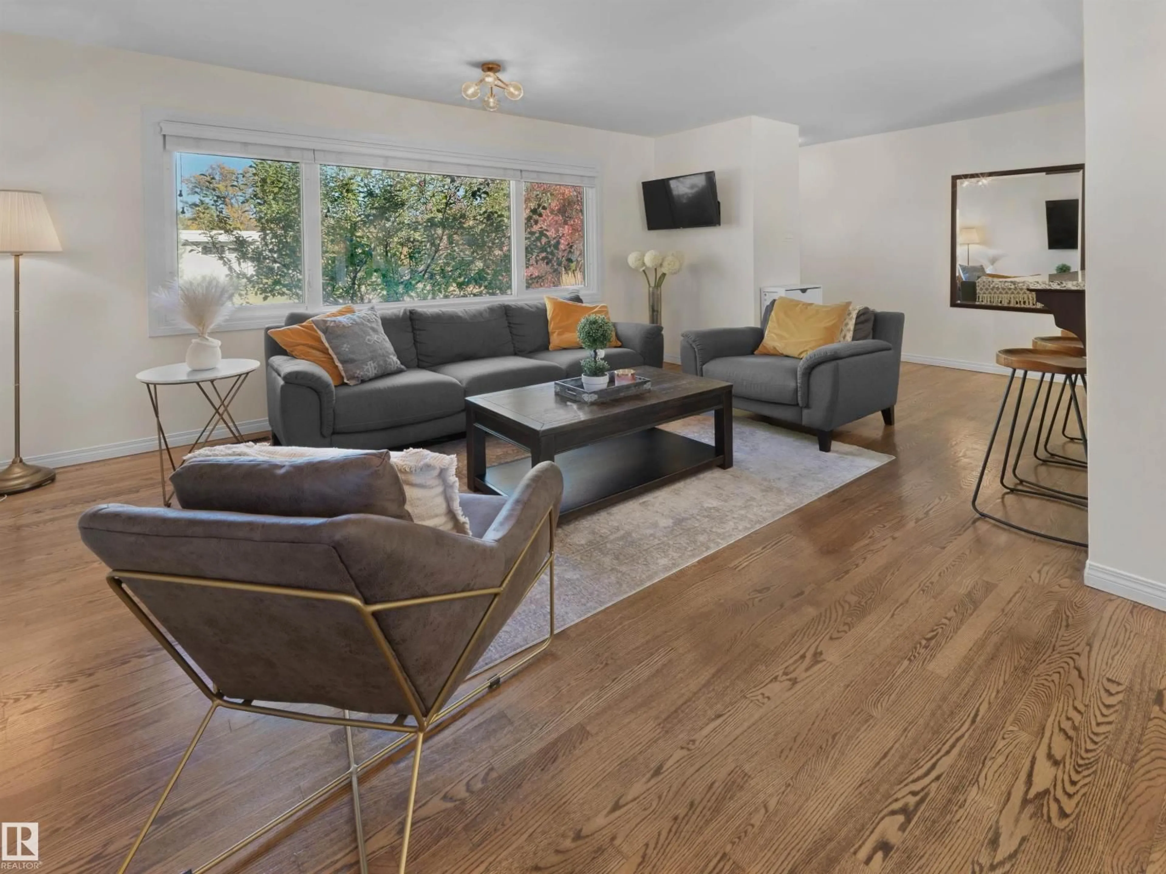 Living room with furniture, wood/laminate floor for NW - 14527 86 AV, Edmonton Alberta T5R4B5