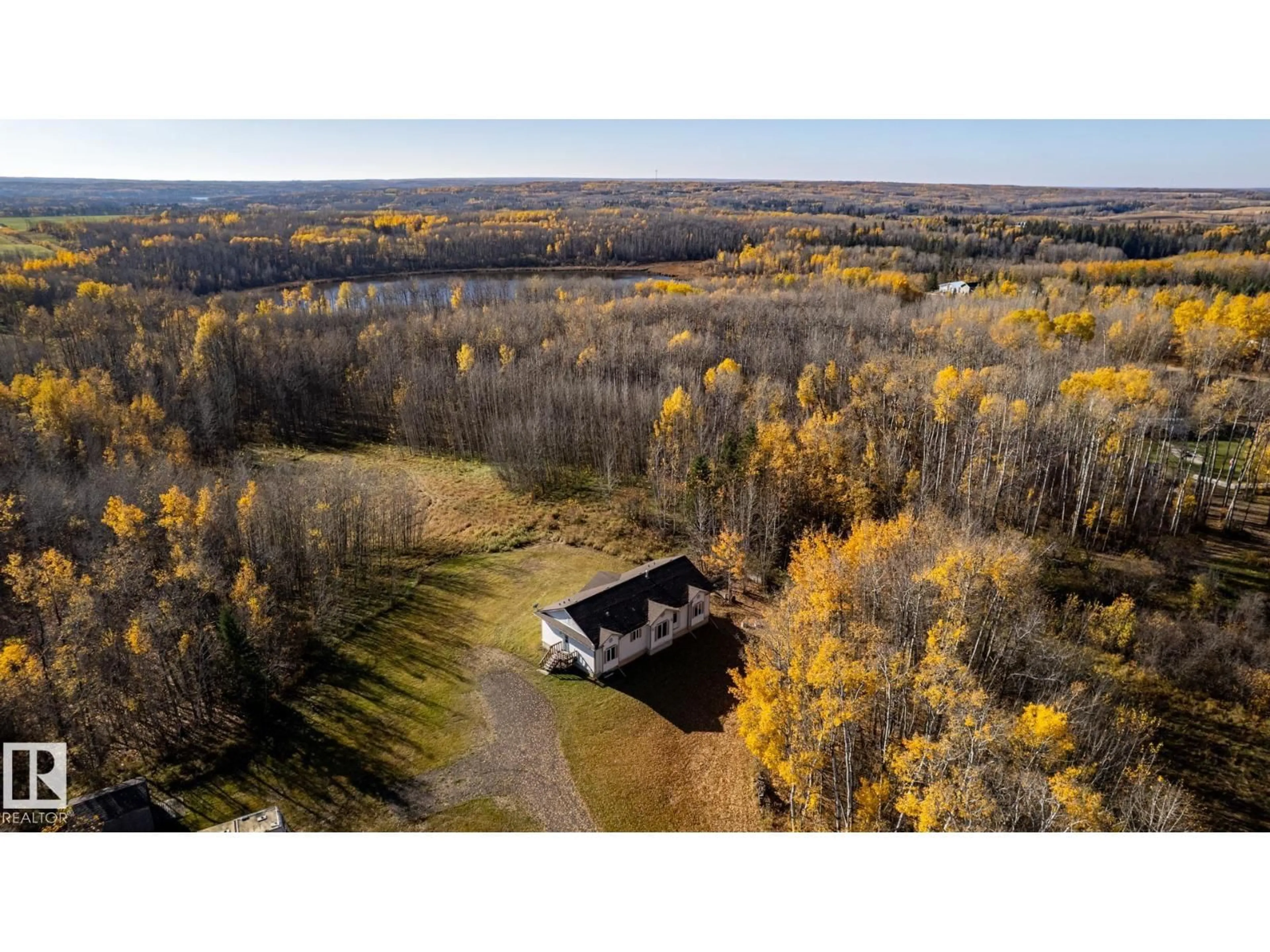 A pic from outside/outdoor area/front of a property/back of a property/a pic from drone, forest/trees view for #8 - 55220 RANGE ROAD 13, Rural Lac Ste. Anne County Alberta T0E1V0