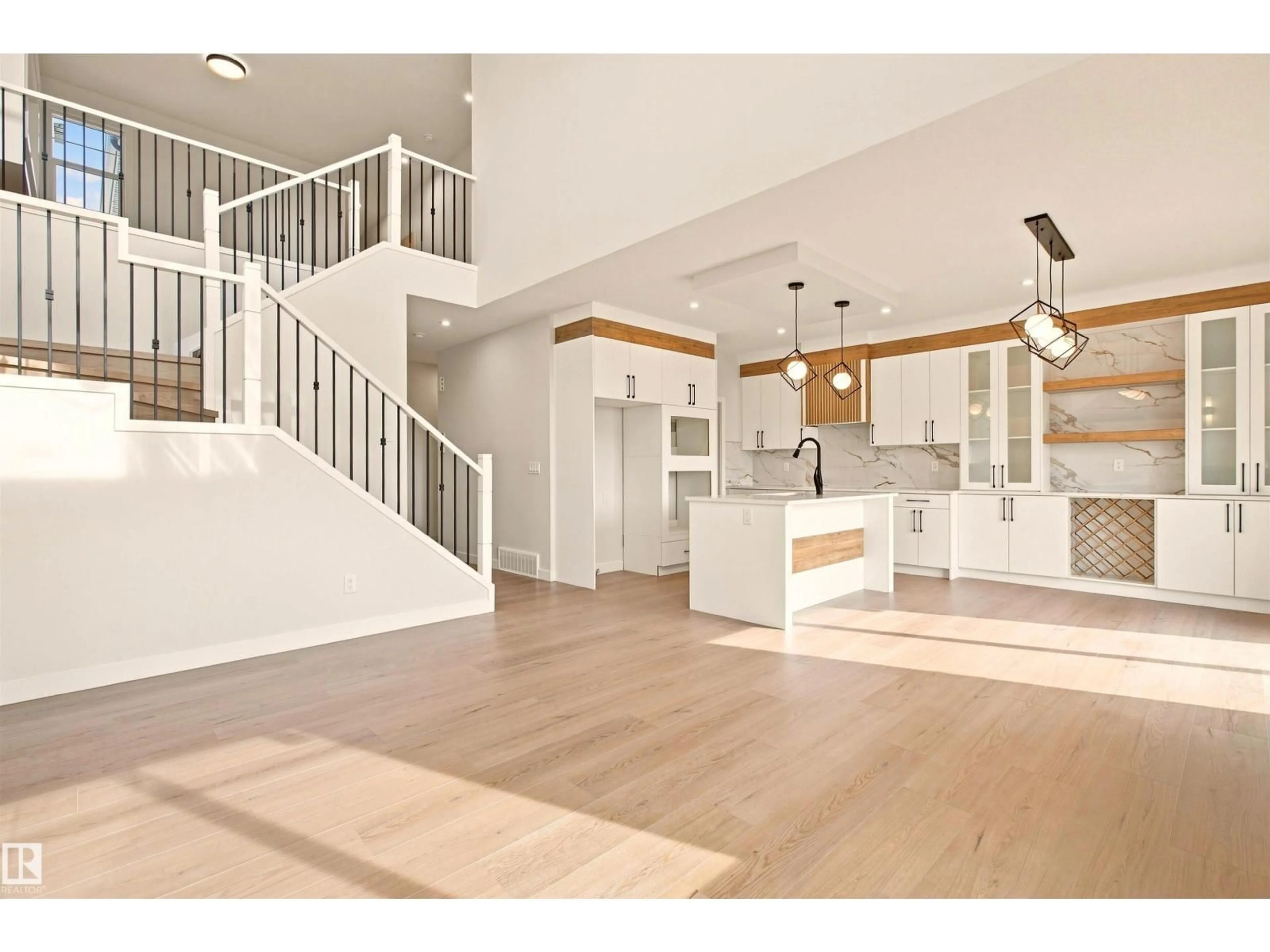 Open concept kitchen, wood/laminate floor for 10406 104 ST, Morinville Alberta T8R0C9
