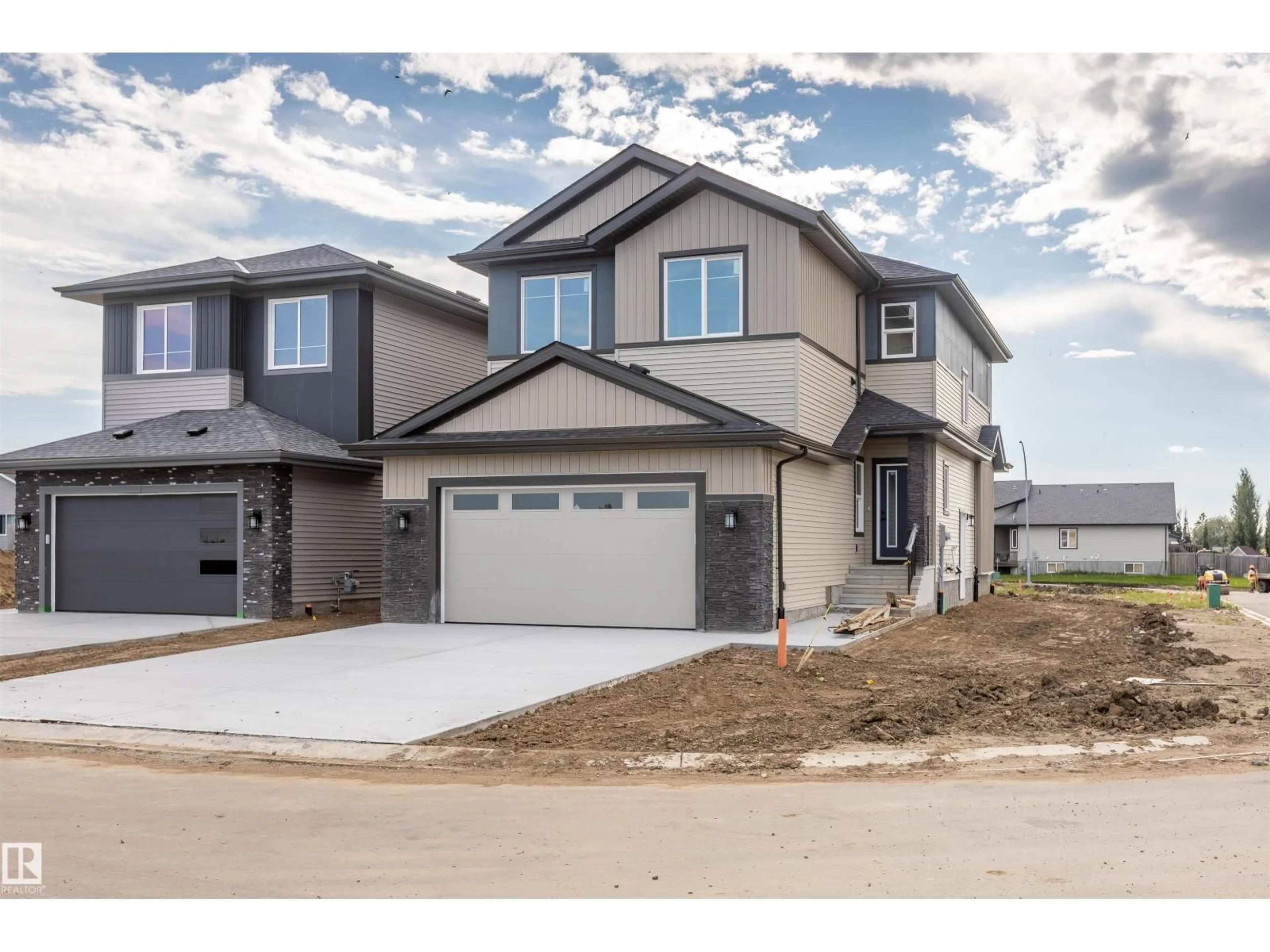 Home with vinyl exterior material, street for 10410 104 ST, Morinville Alberta T8R0C9