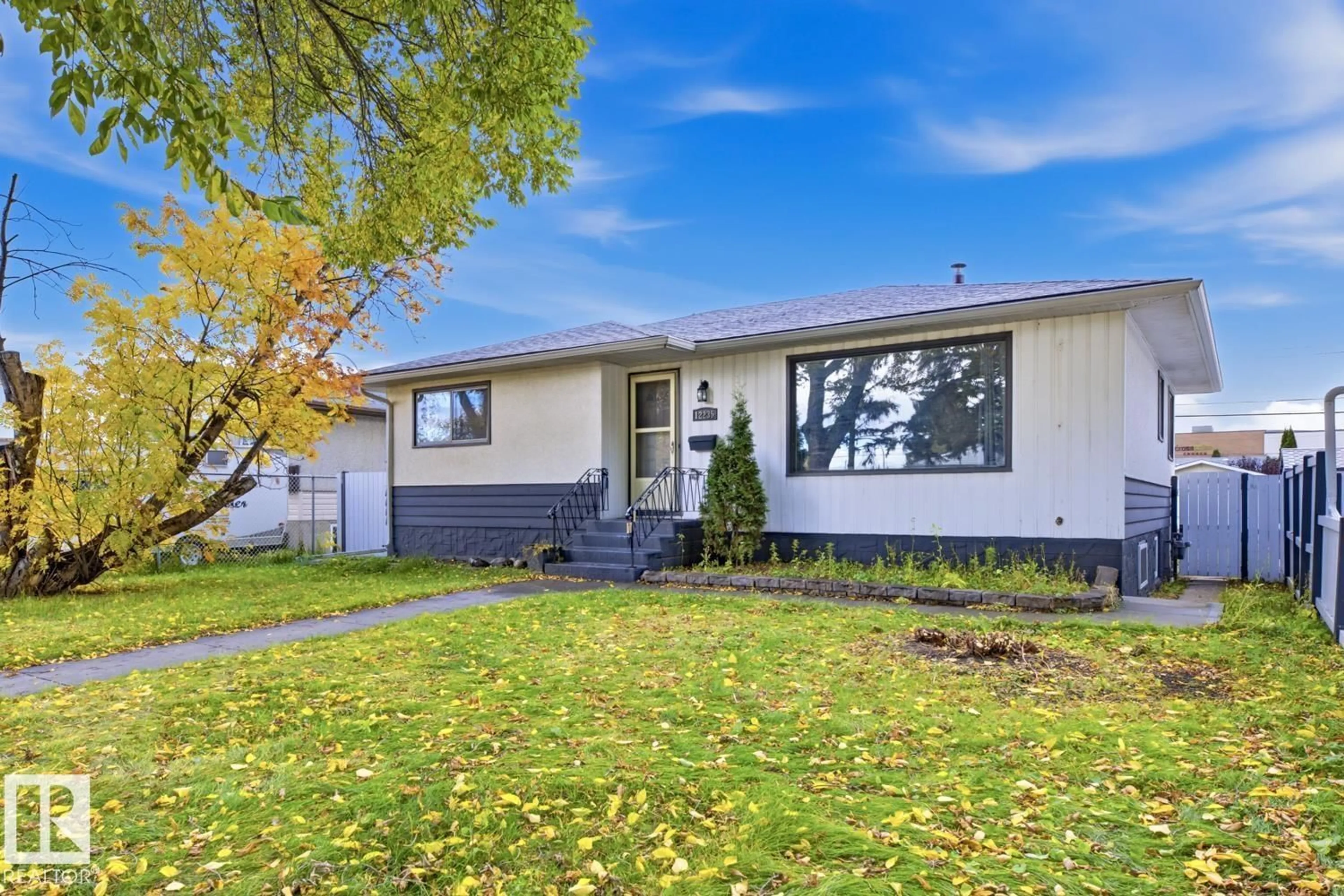 Home with vinyl exterior material, street for NW - 12235 51 ST, Edmonton Alberta T5W3H1
