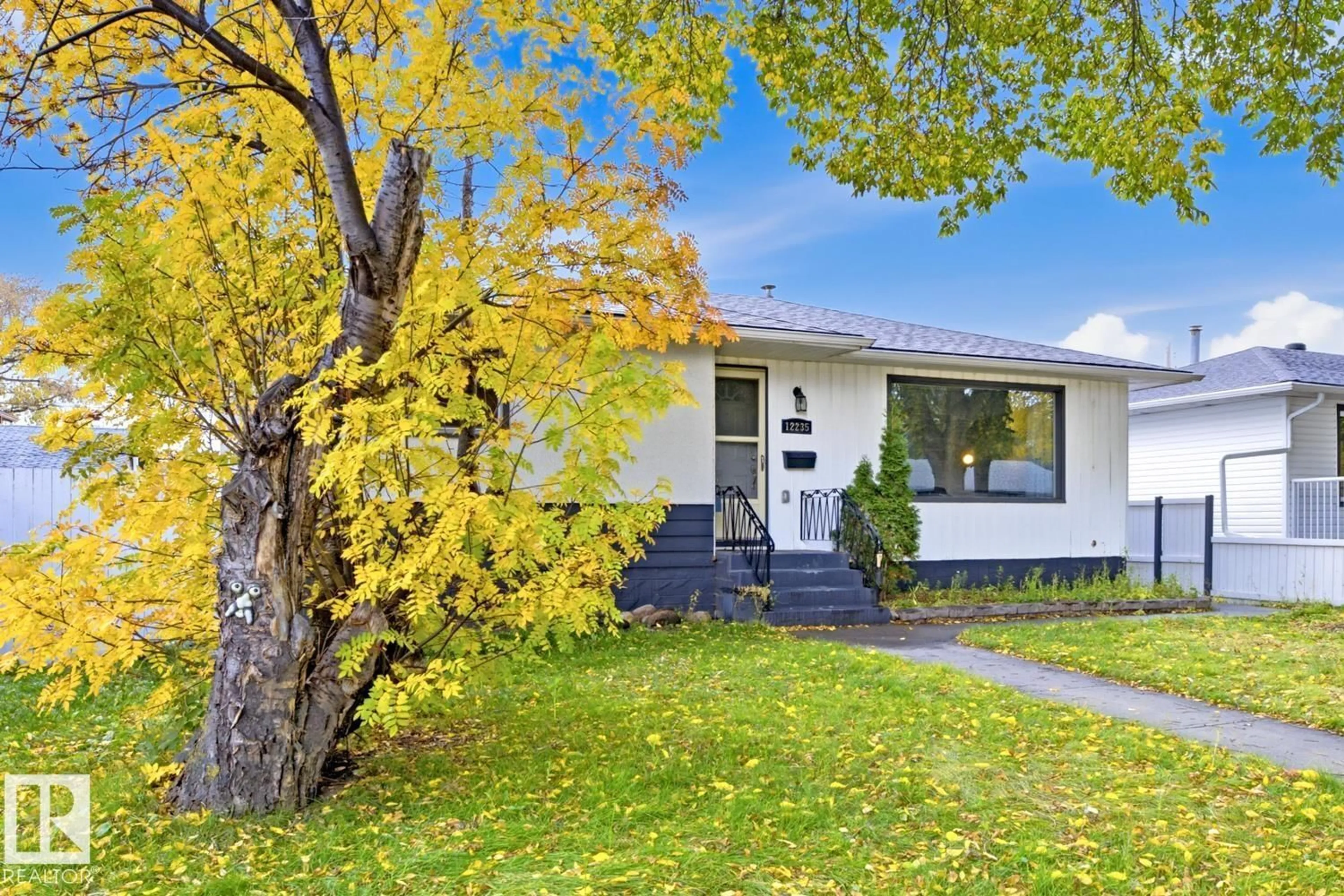 Home with vinyl exterior material, street for NW - 12235 51 ST, Edmonton Alberta T5W3H1