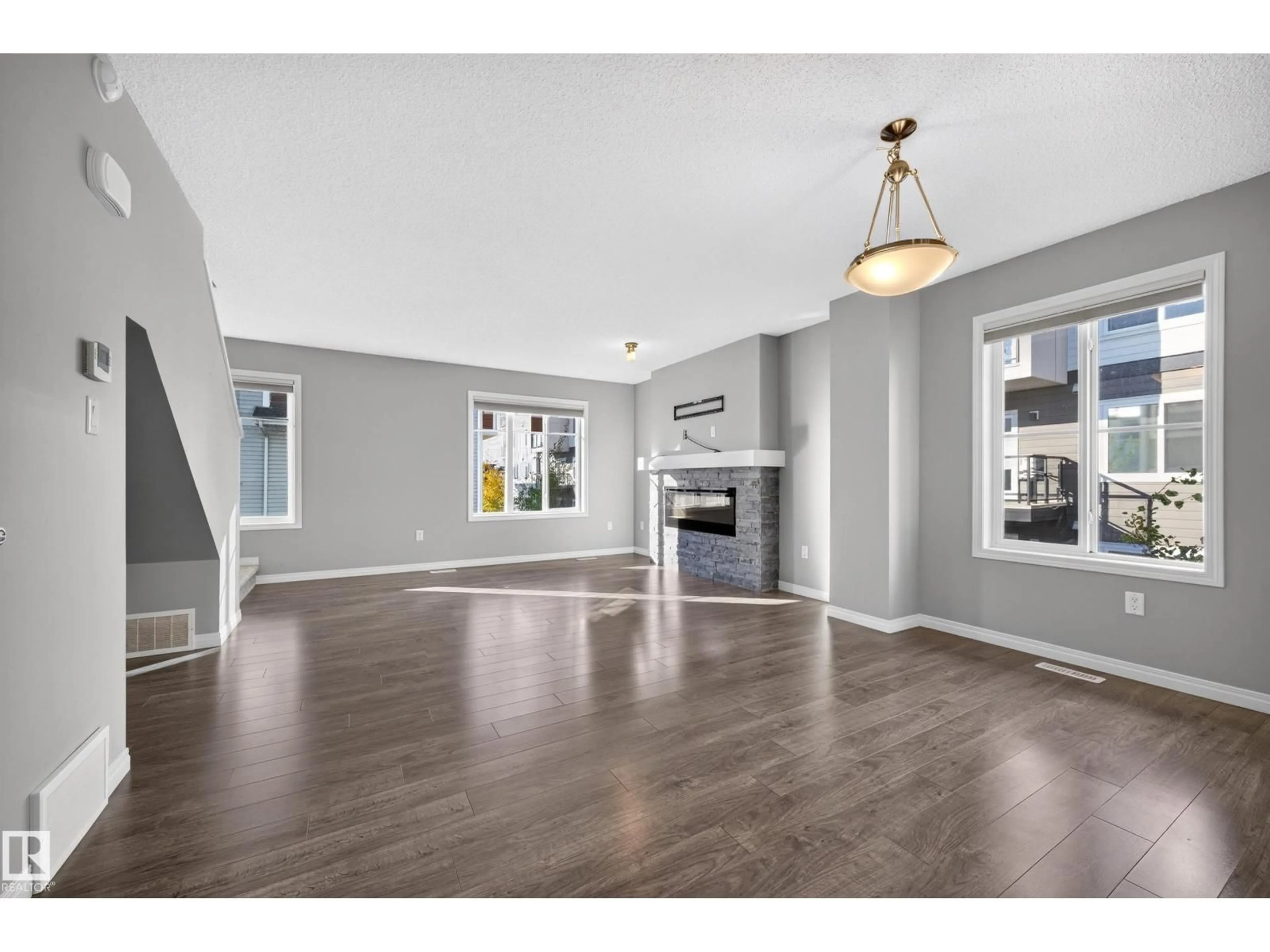 Open concept kitchen, wood/laminate floor for #81 - 2905 141 ST, Edmonton Alberta T6W3M4