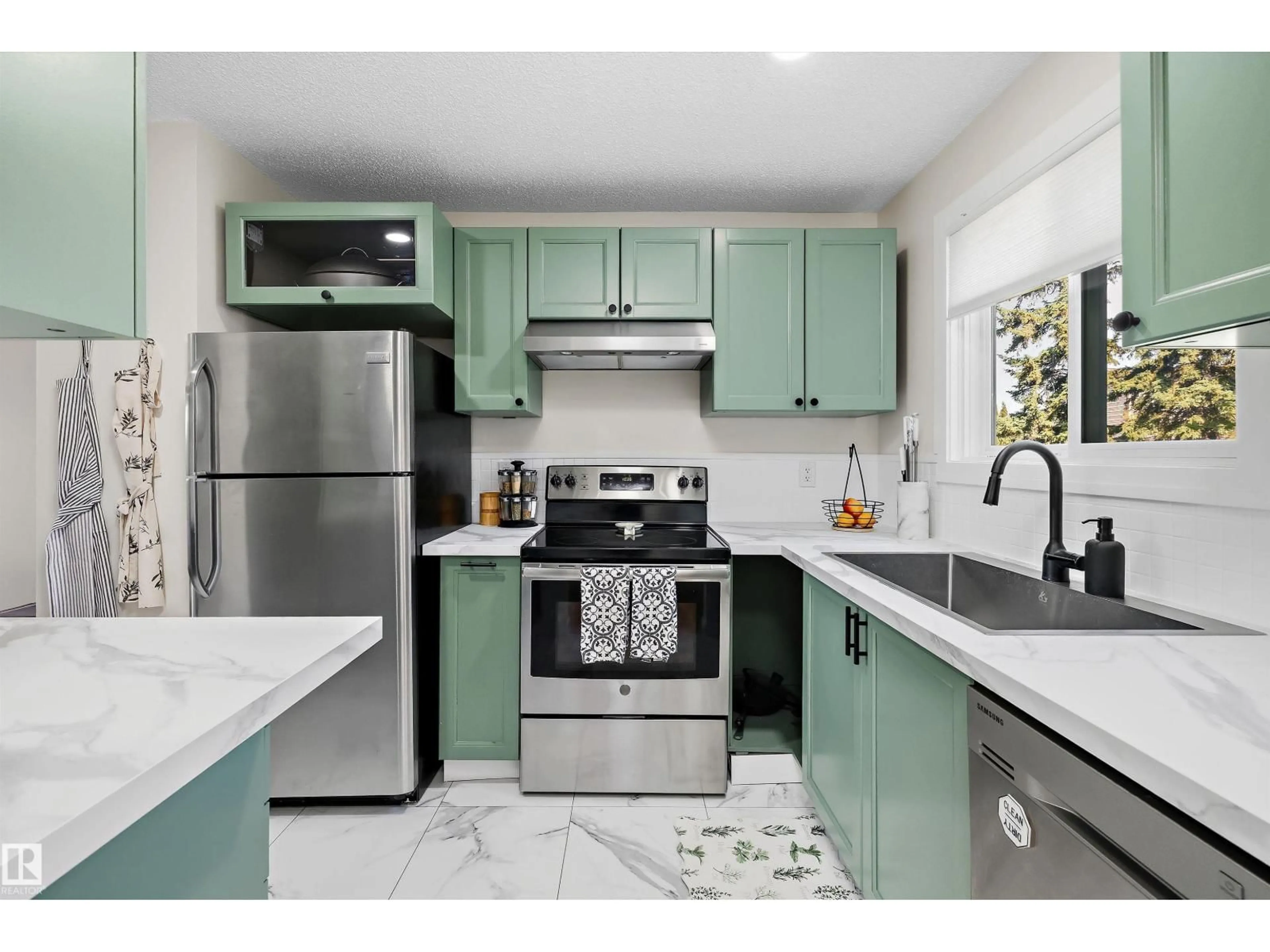 Open concept kitchen, ceramic/tile floor for NW - 14207 23 ST, Edmonton Alberta T5Y1N1