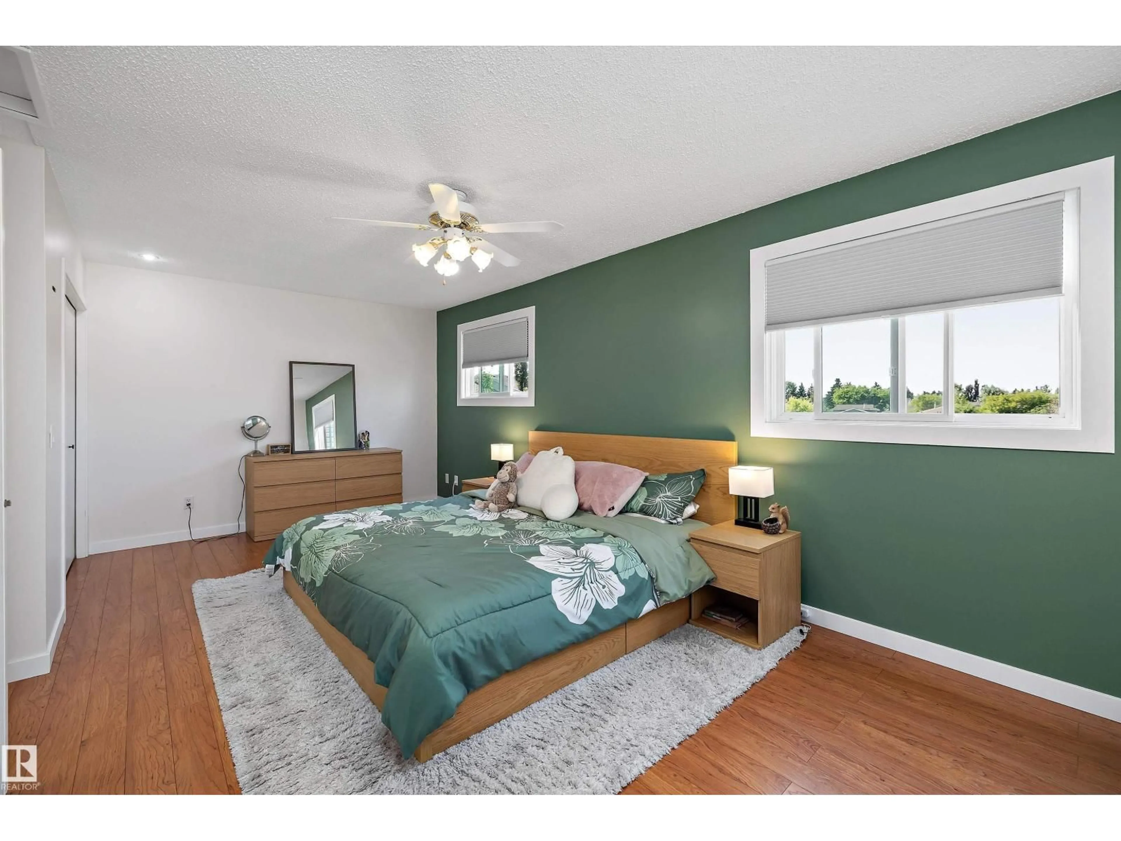 Bedroom with bed, wood/laminate floor for NW - 14207 23 ST, Edmonton Alberta T5Y1N1