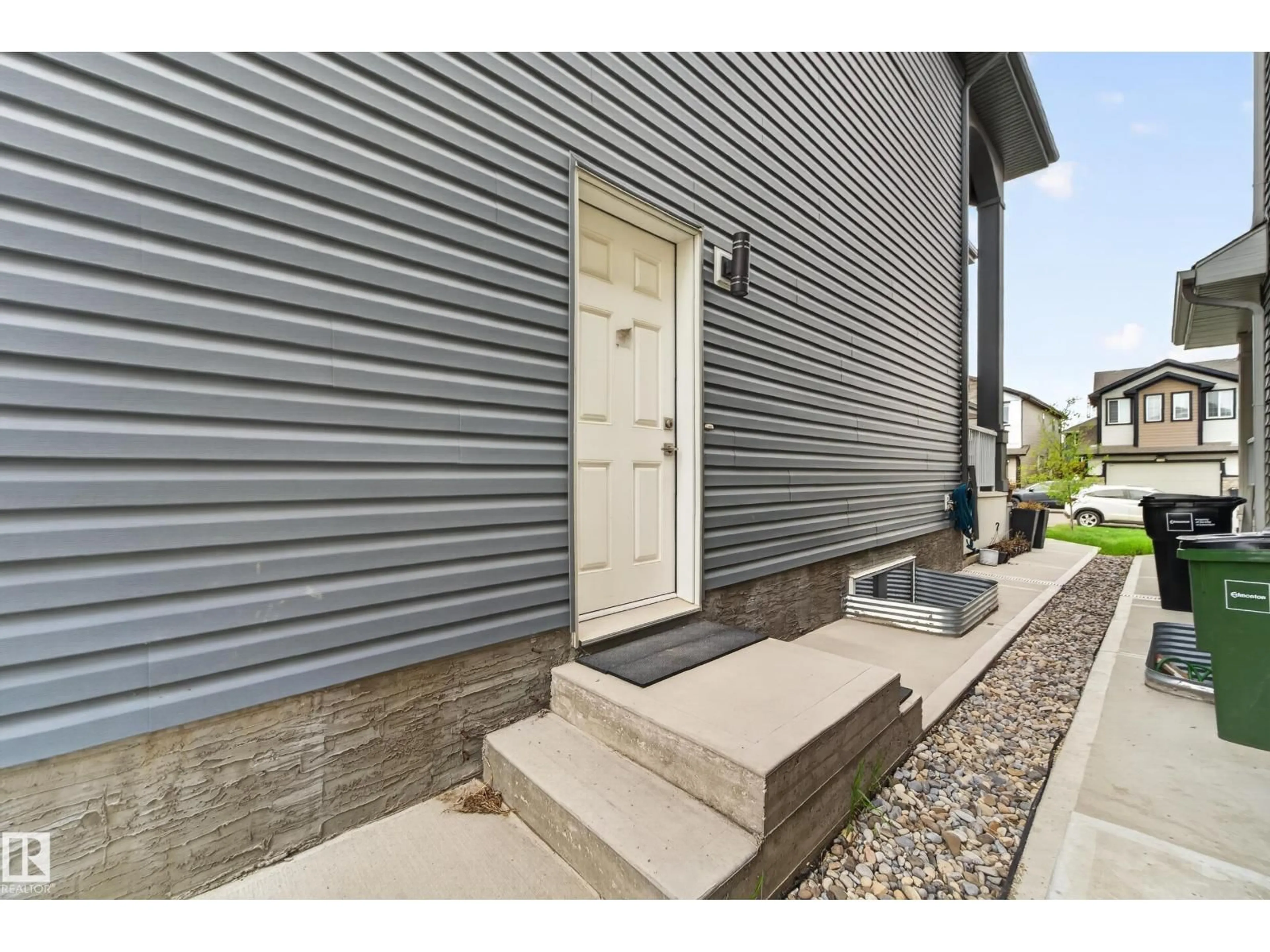 Home with vinyl exterior material, street for 1231 26 ST, Edmonton Alberta T6T2J9
