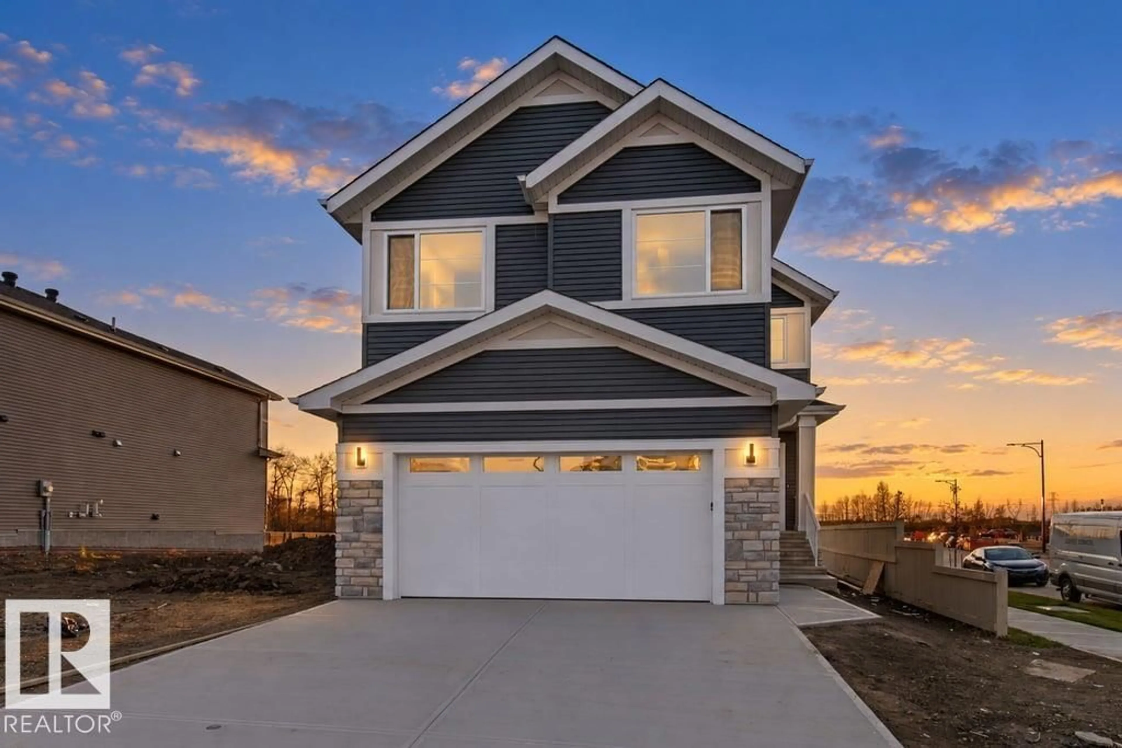 Home with vinyl exterior material, street for 704 ELDERBERRY CL, Edmonton Alberta T6M3J6