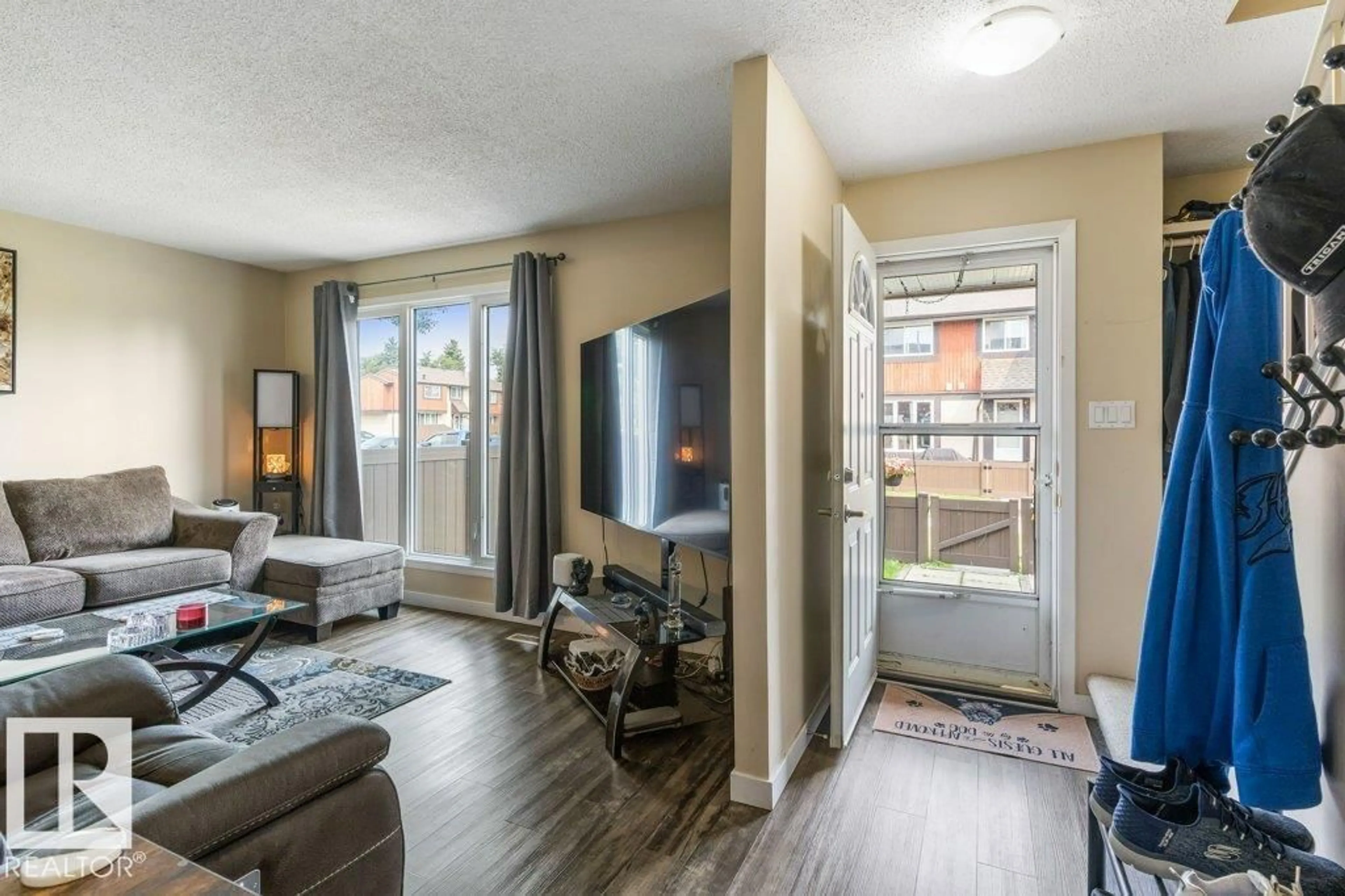 Living room with furniture, wood/laminate floor for 8306 182 ST, Edmonton Alberta T5T1T9
