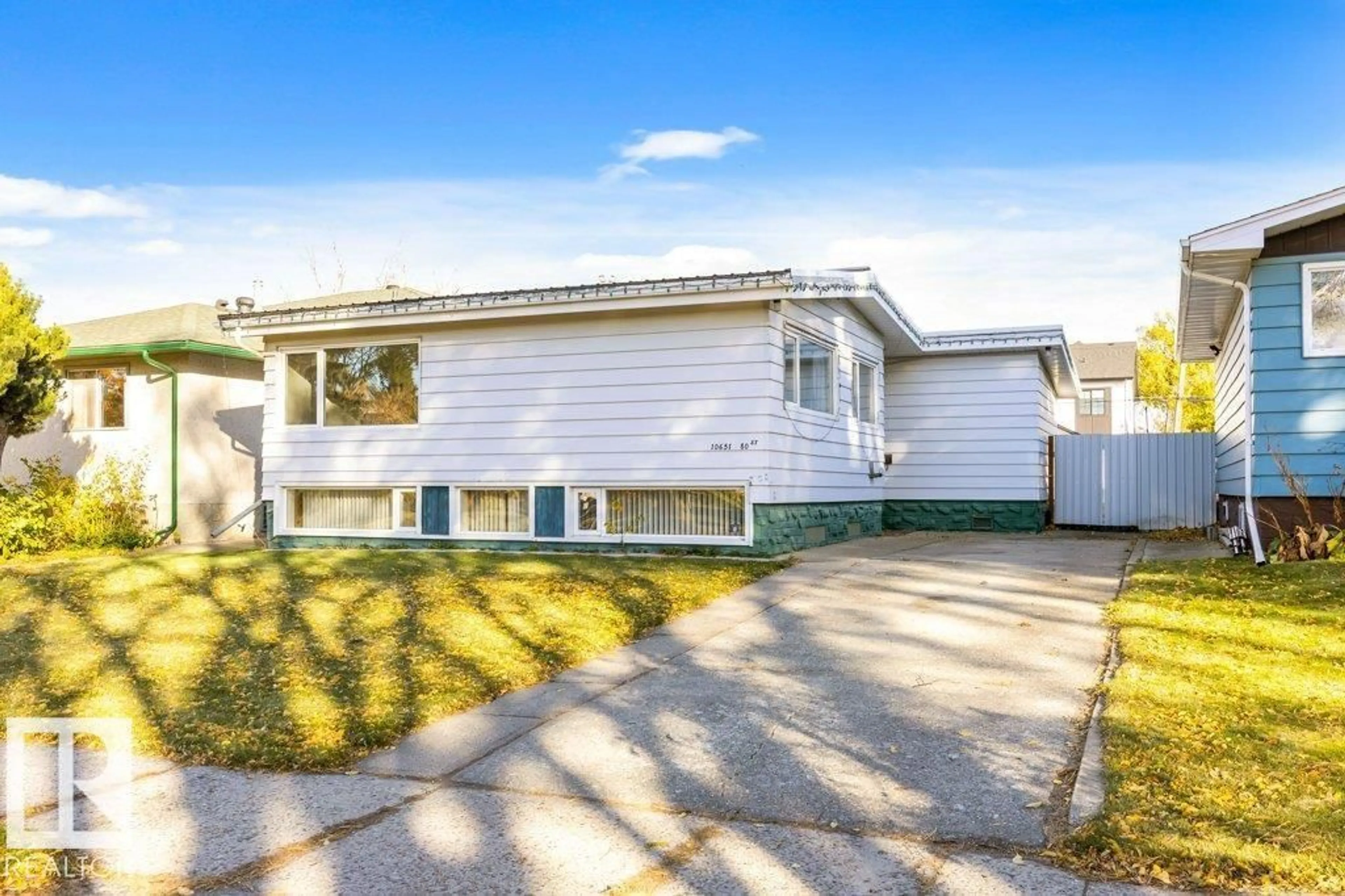 Home with vinyl exterior material, street for NW - 10651 80 ST, Edmonton Alberta T6A3J9