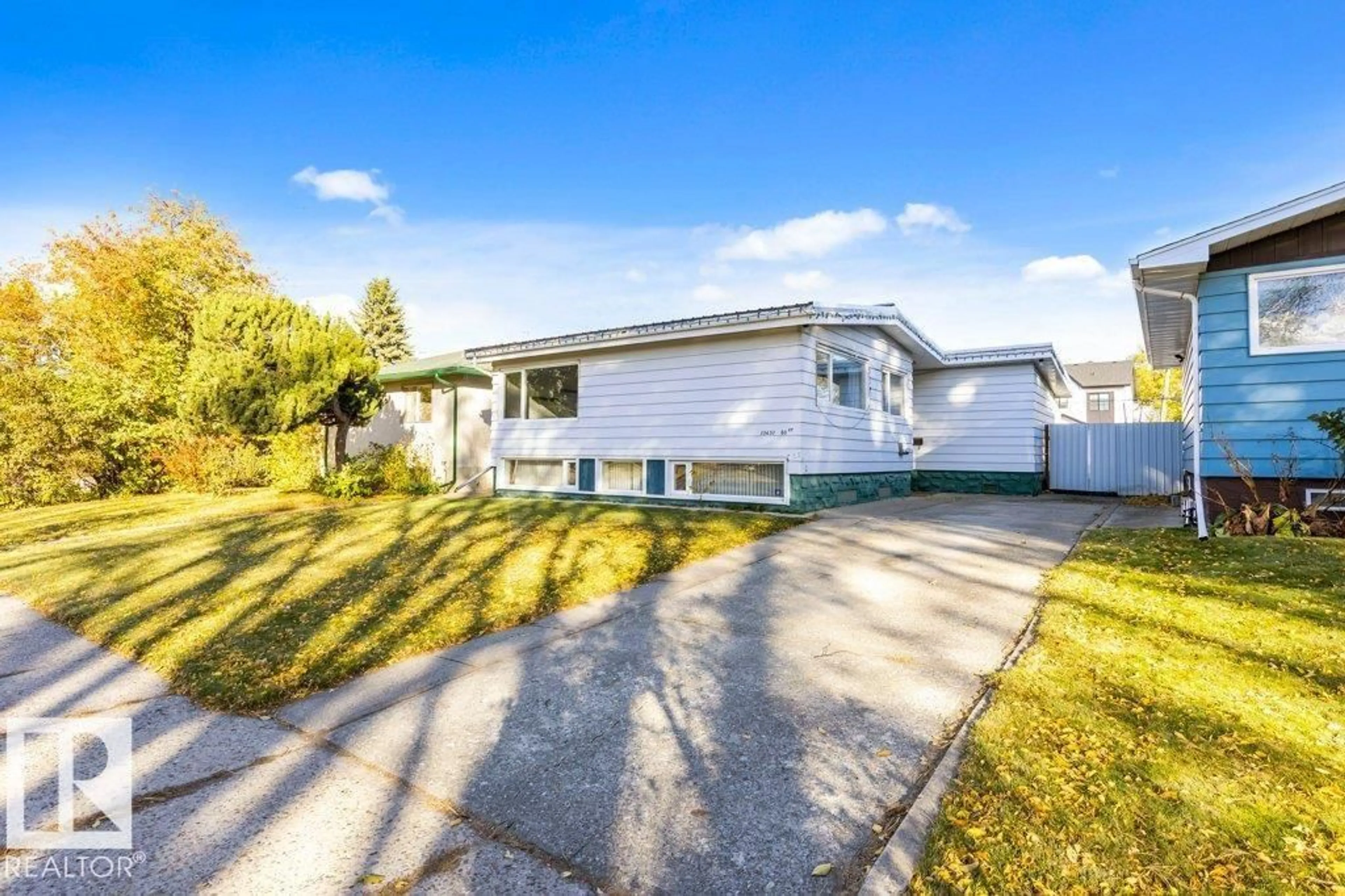 Home with vinyl exterior material, street for NW - 10651 80 ST, Edmonton Alberta T6A3J9