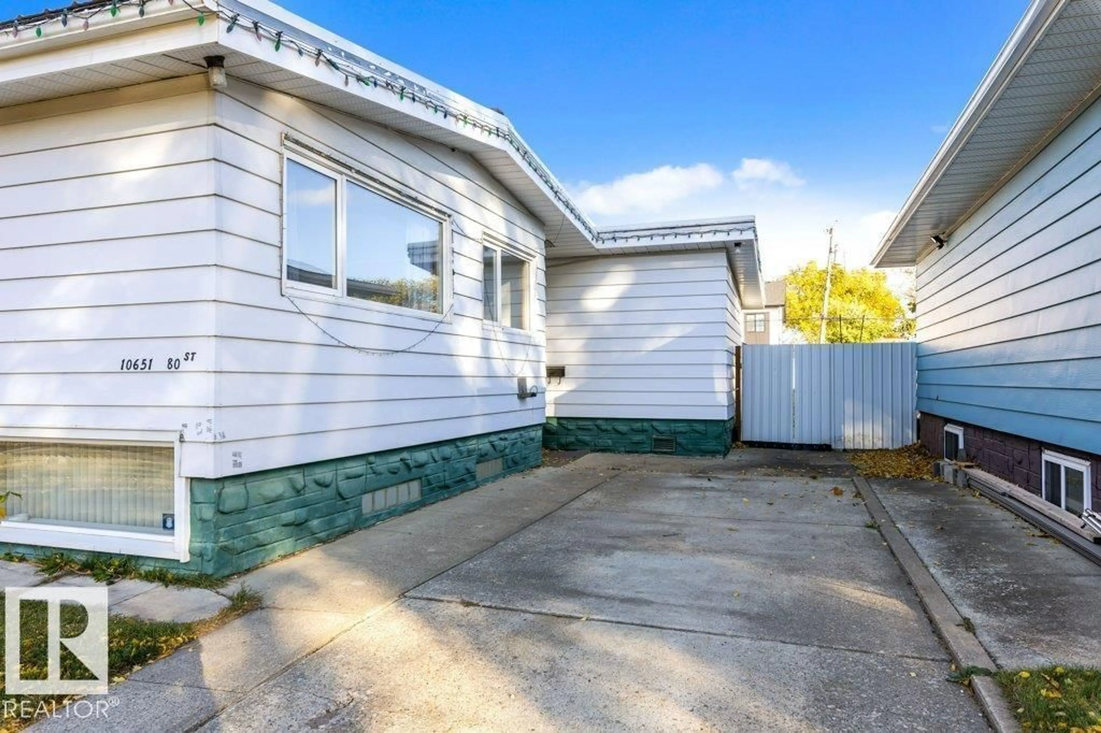 Home with vinyl exterior material, street for NW - 10651 80 ST, Edmonton Alberta T6A3J9