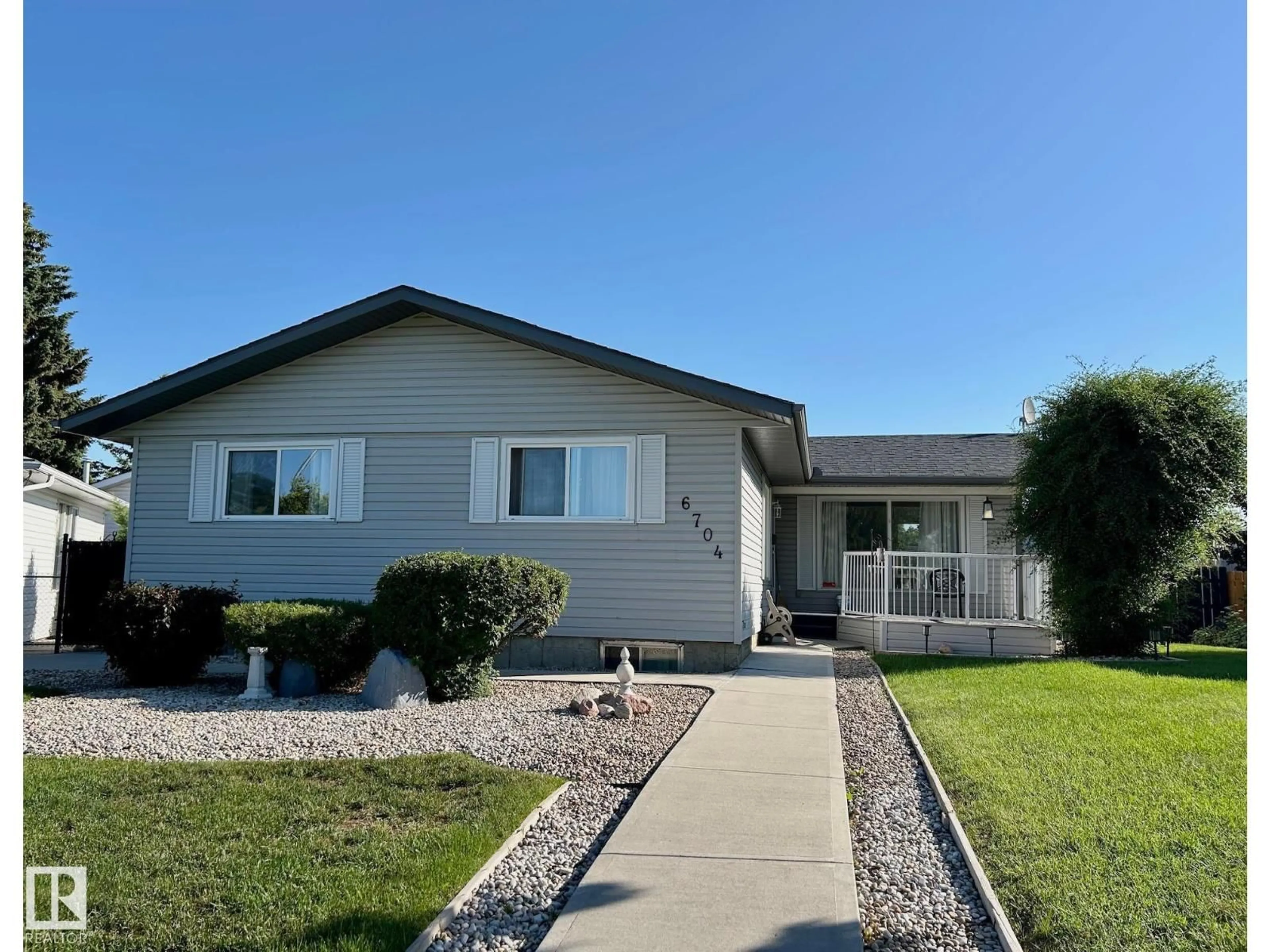 Home with vinyl exterior material, street for 6704 152A AV, Edmonton Alberta T5C2Y9
