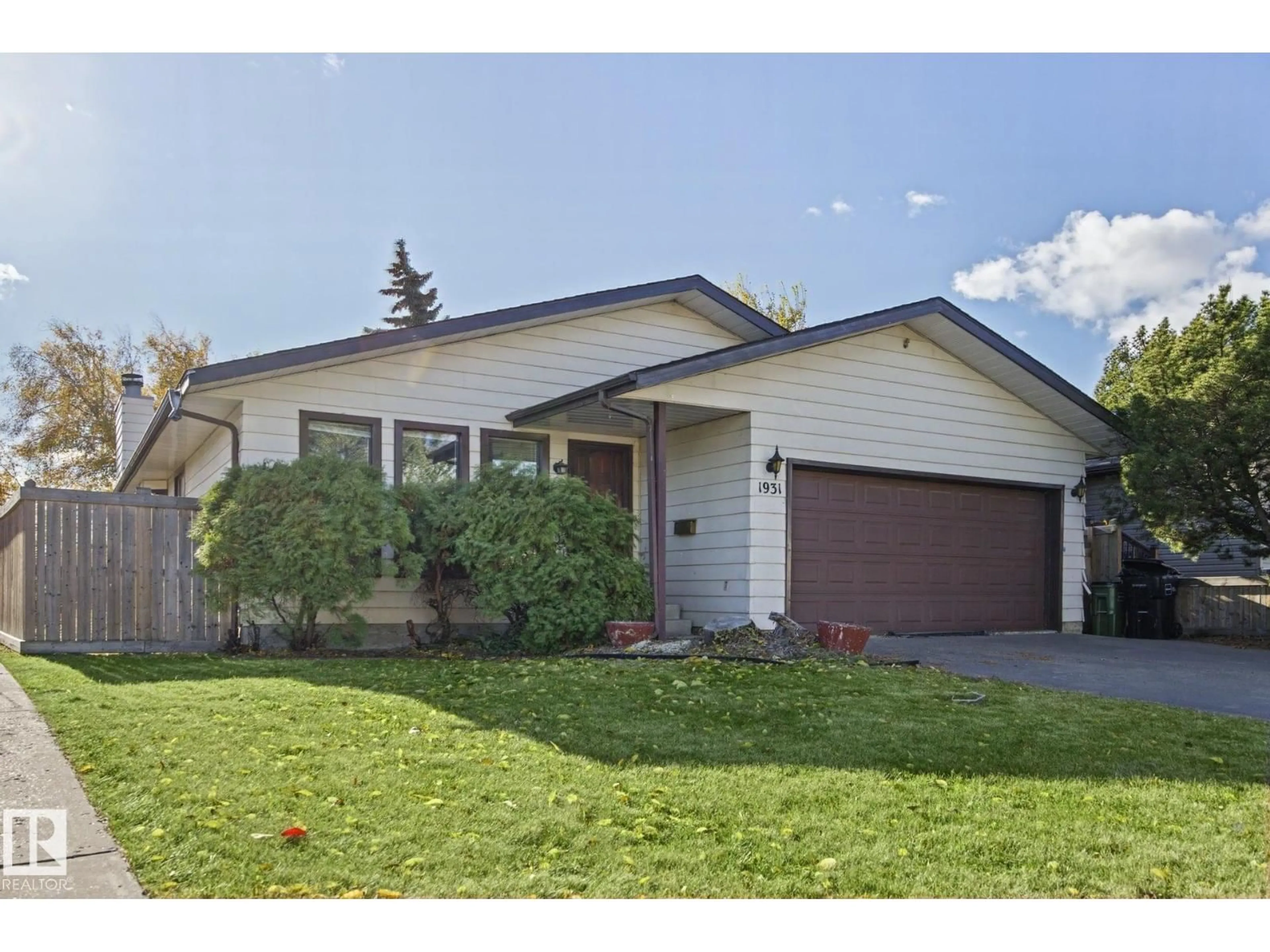 Home with vinyl exterior material, street for 1931 145 AV, Edmonton Alberta T5Y1V1