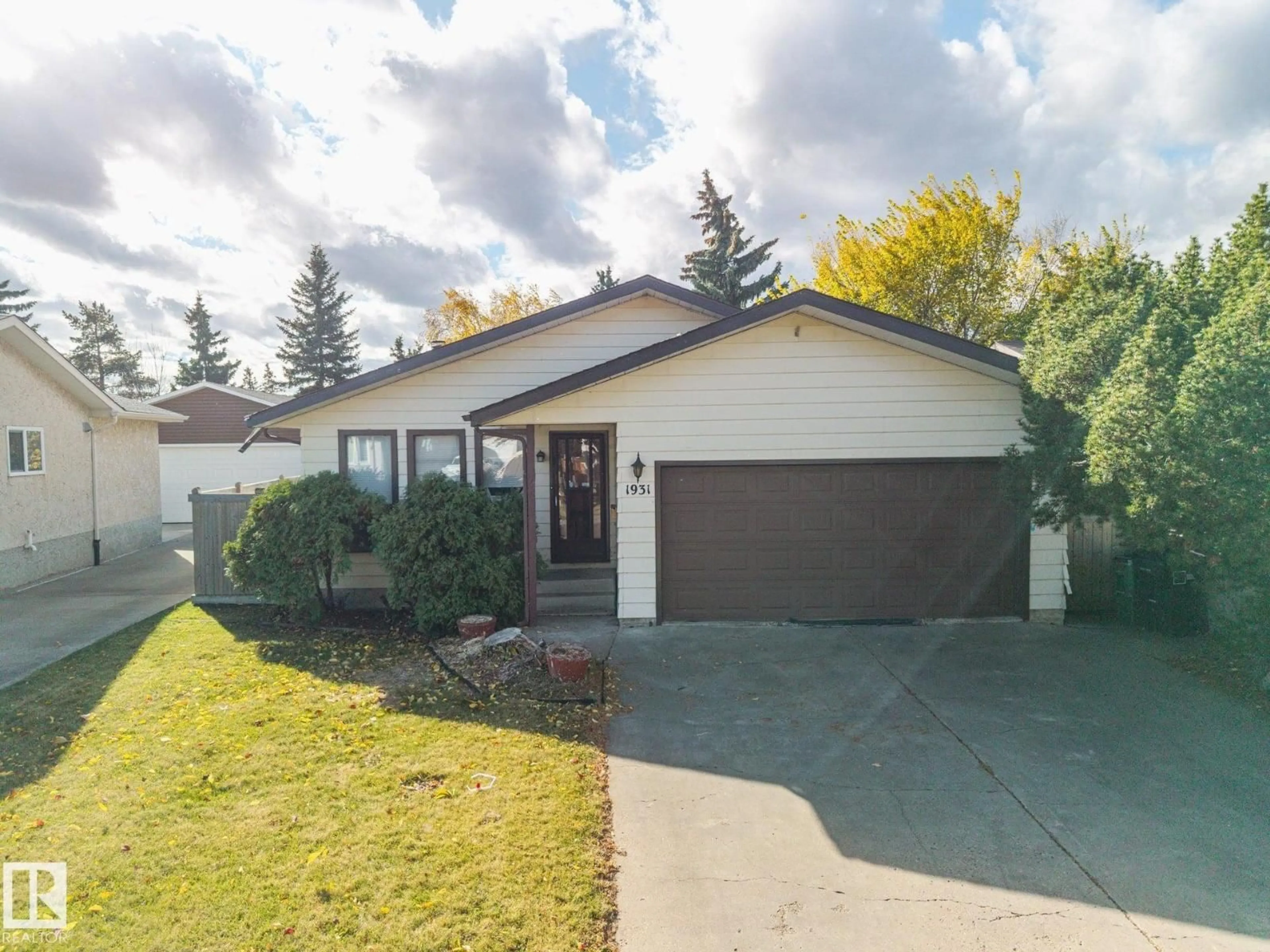 Home with vinyl exterior material, street for 1931 145 AV, Edmonton Alberta T5Y1V1