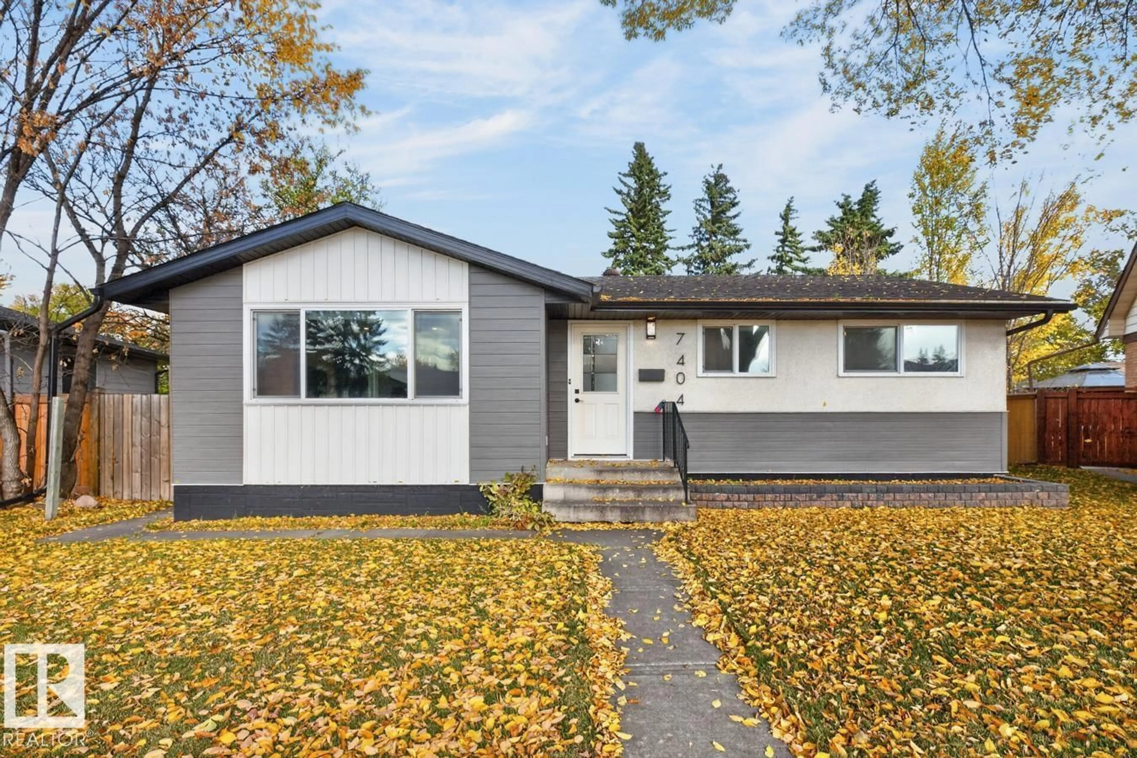 Home with vinyl exterior material, street for 7404 92 AV, Edmonton Alberta T6B6B0