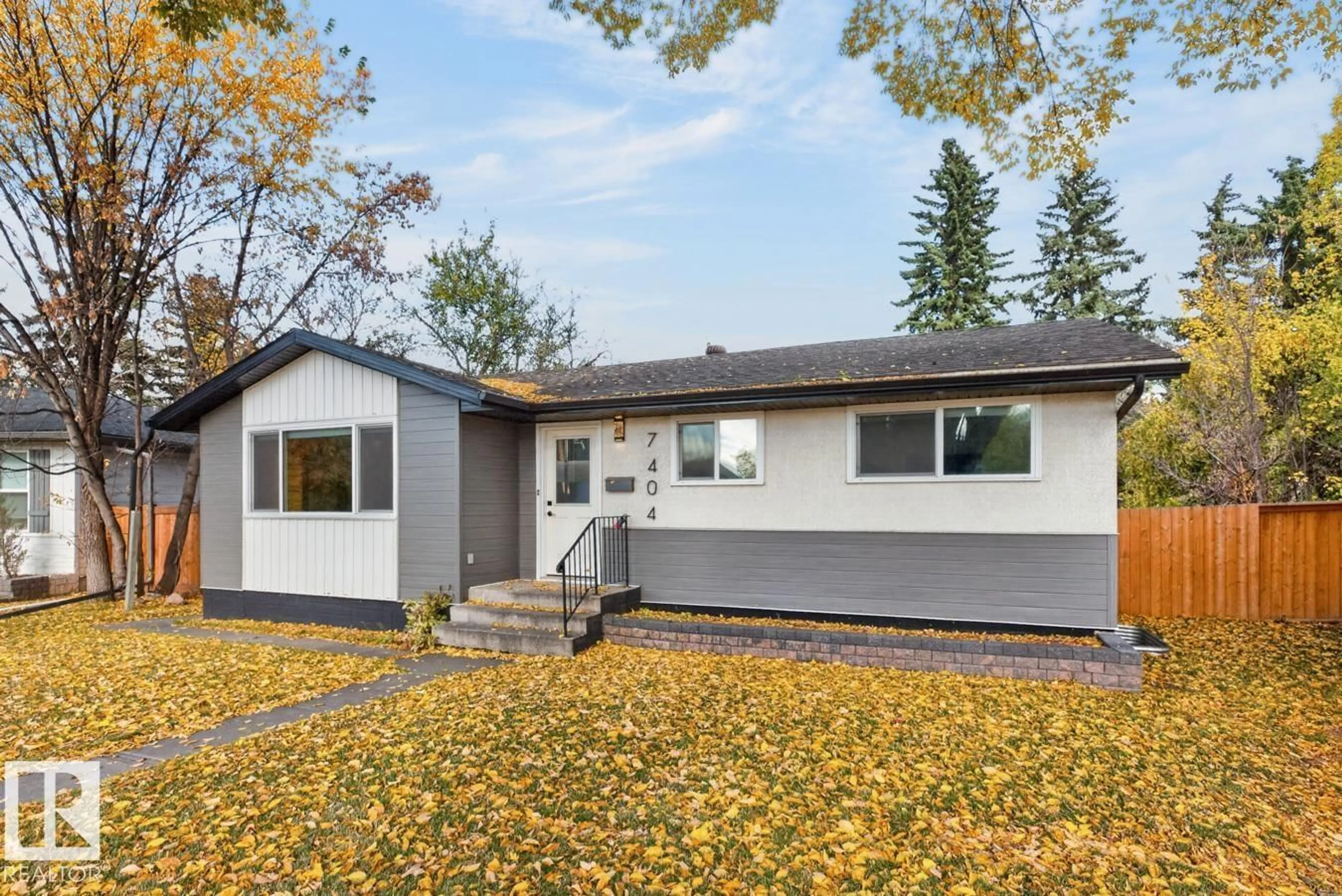 Home with vinyl exterior material, street for 7404 92 AV, Edmonton Alberta T6B6B0