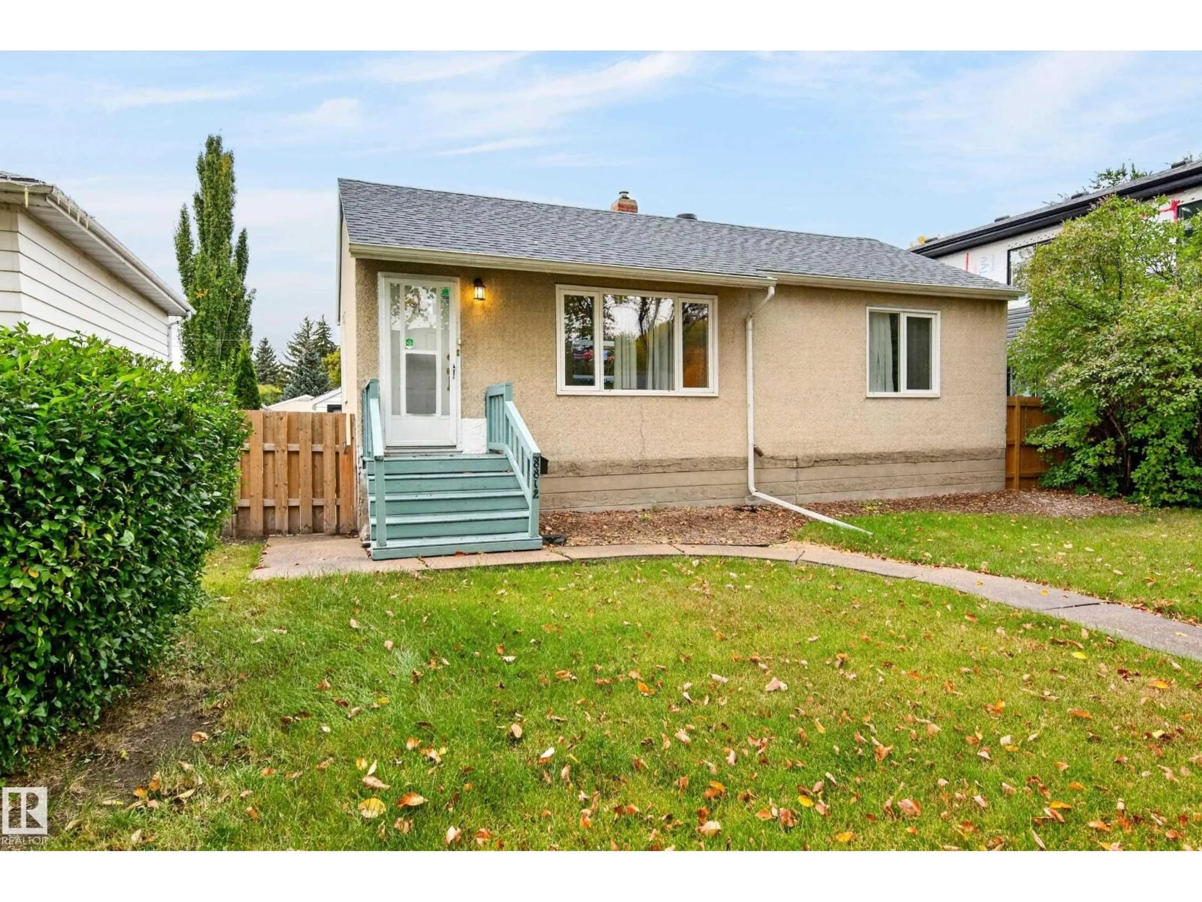 Home with vinyl exterior material, street for NW - 8812 79 ST, Edmonton Alberta T6C2P6