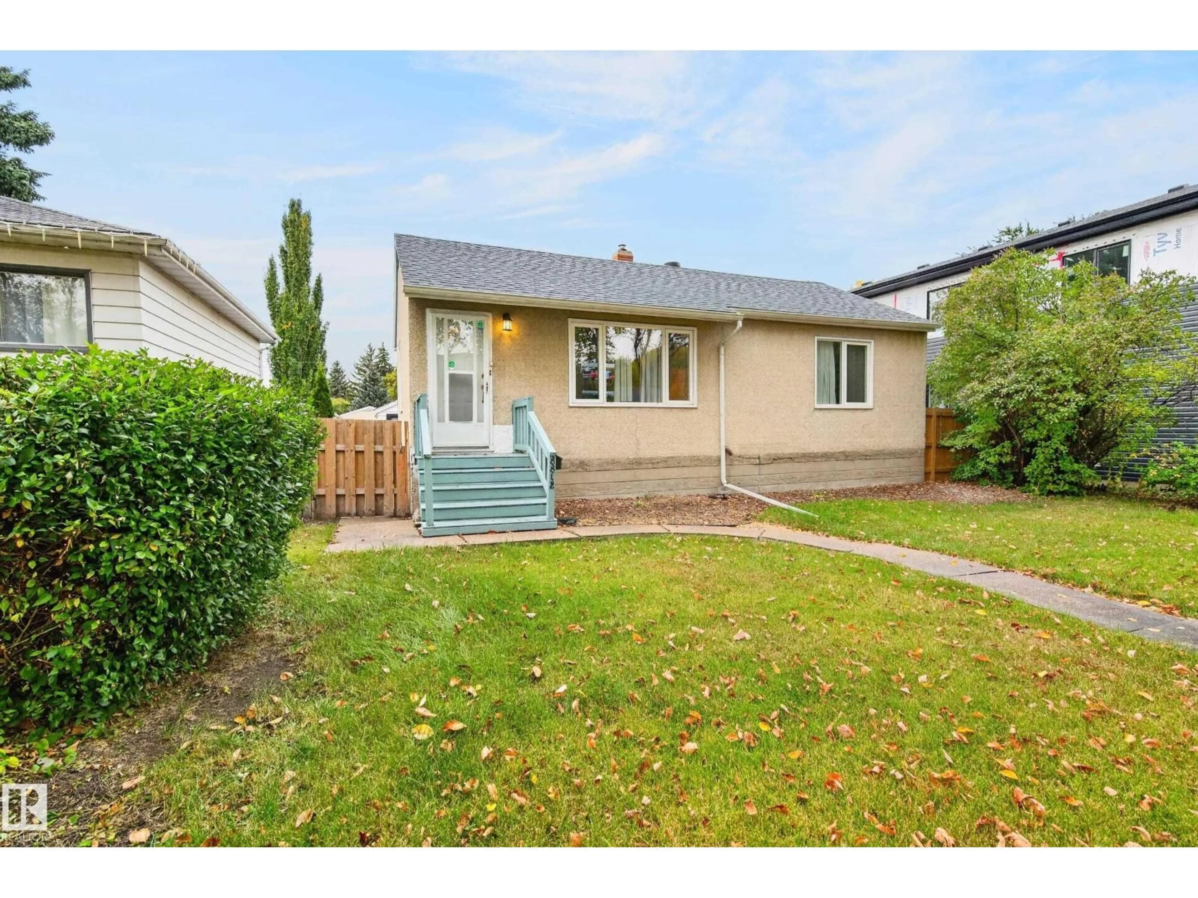 Home with vinyl exterior material, street for NW - 8812 79 ST, Edmonton Alberta T6C2P6