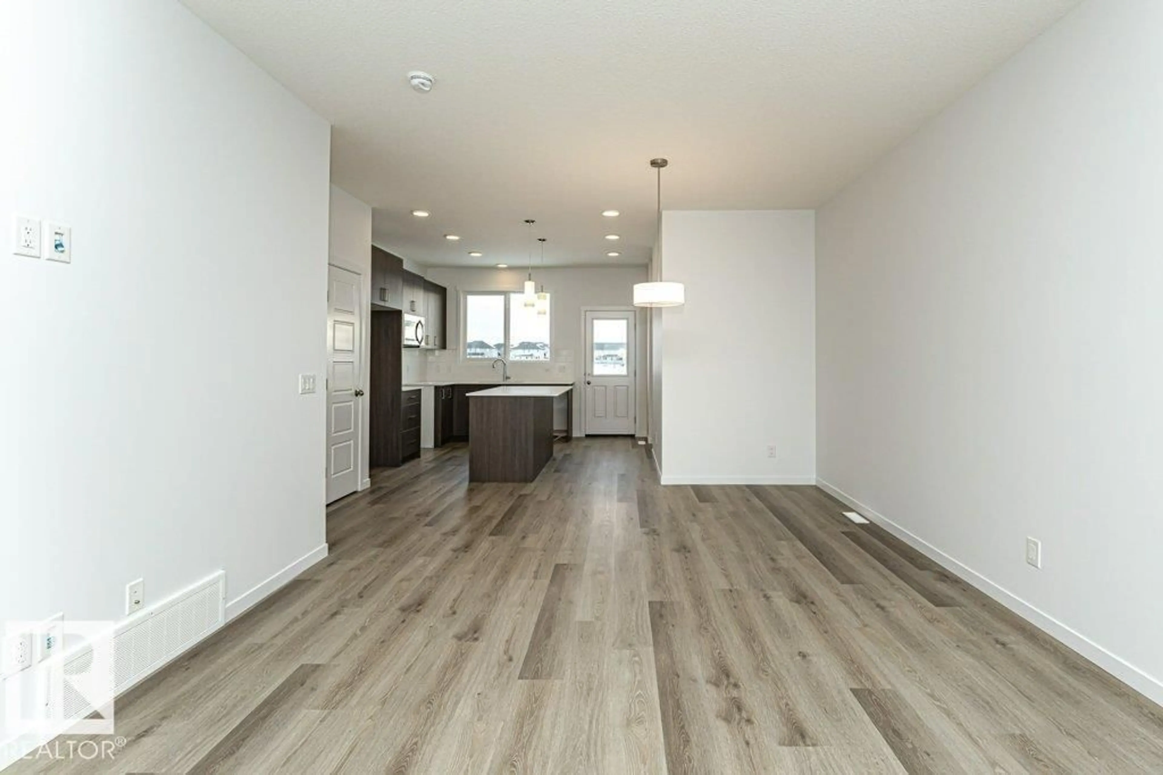 Open concept kitchen, wood/laminate floor for 6407 63 ST, Beaumont Alberta T4X3E2